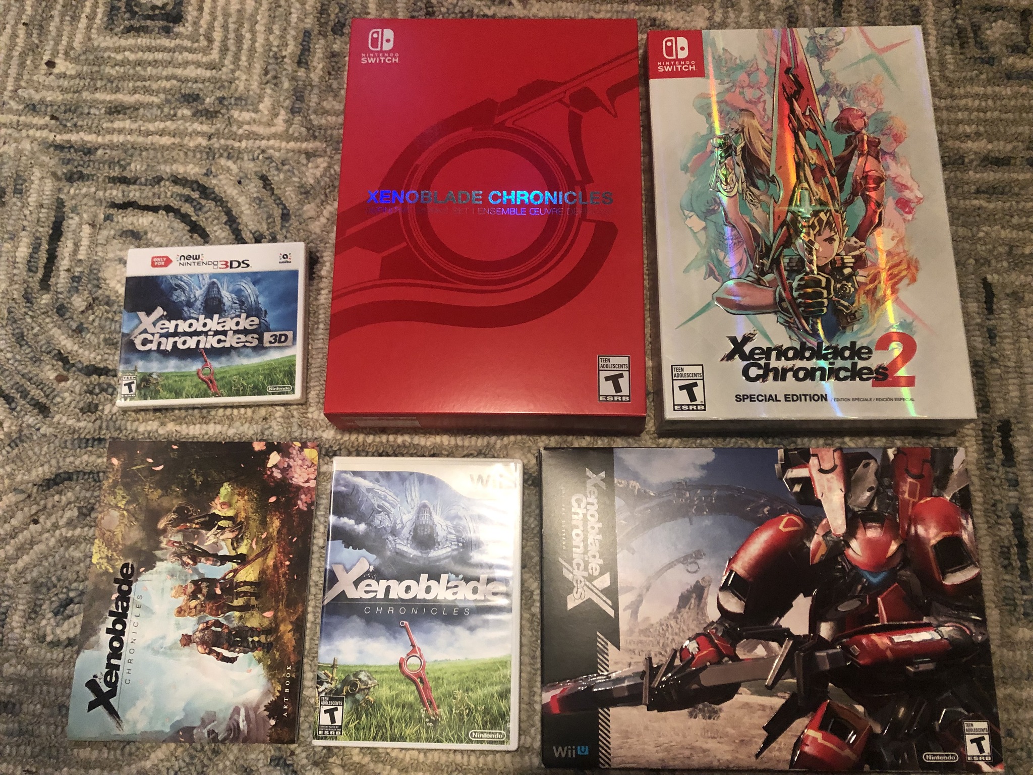 Are the inside artbook, steelcase, etc. the same for all Xenoblade 