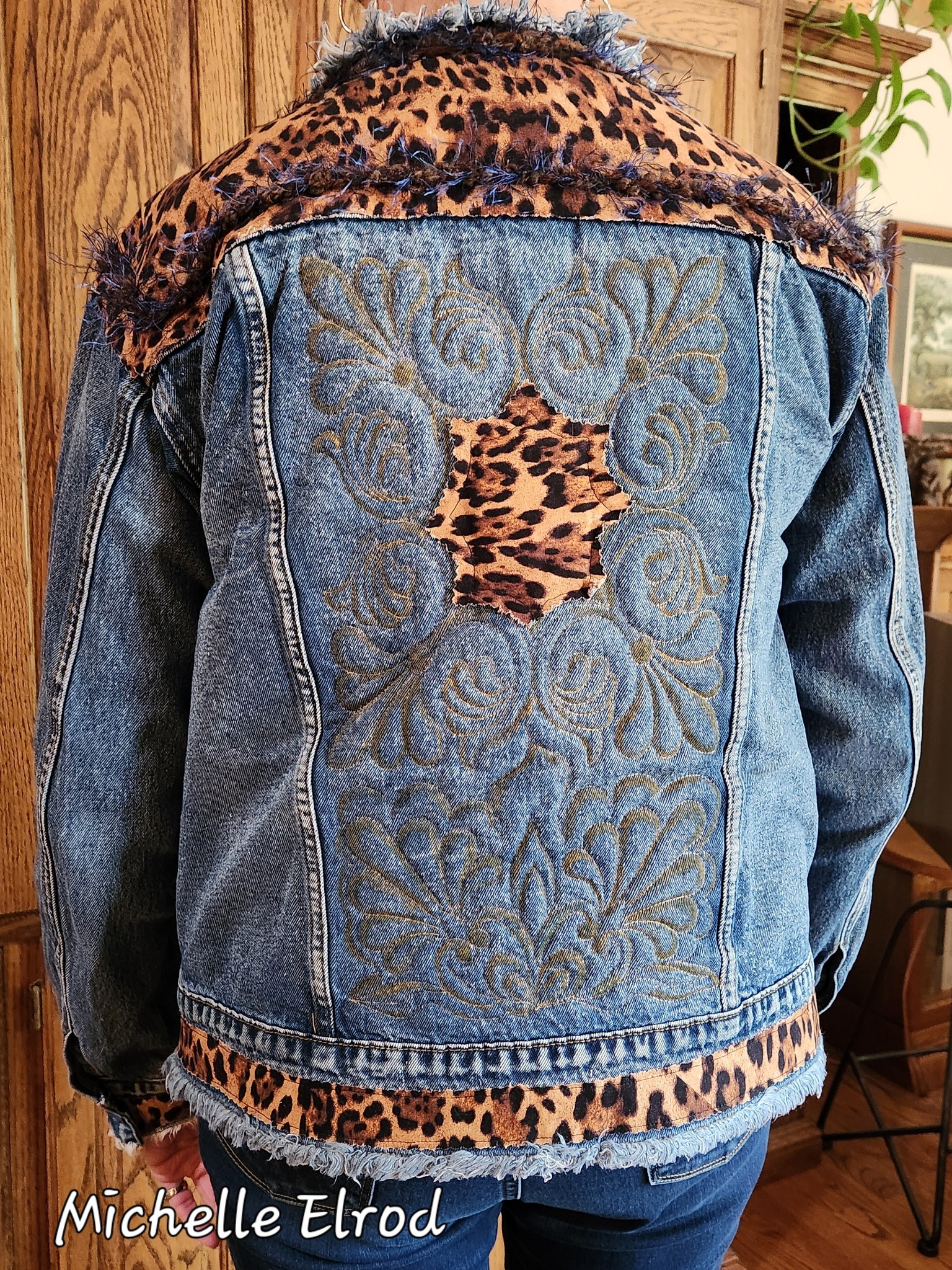 Upcycled jean jacket with animal print design