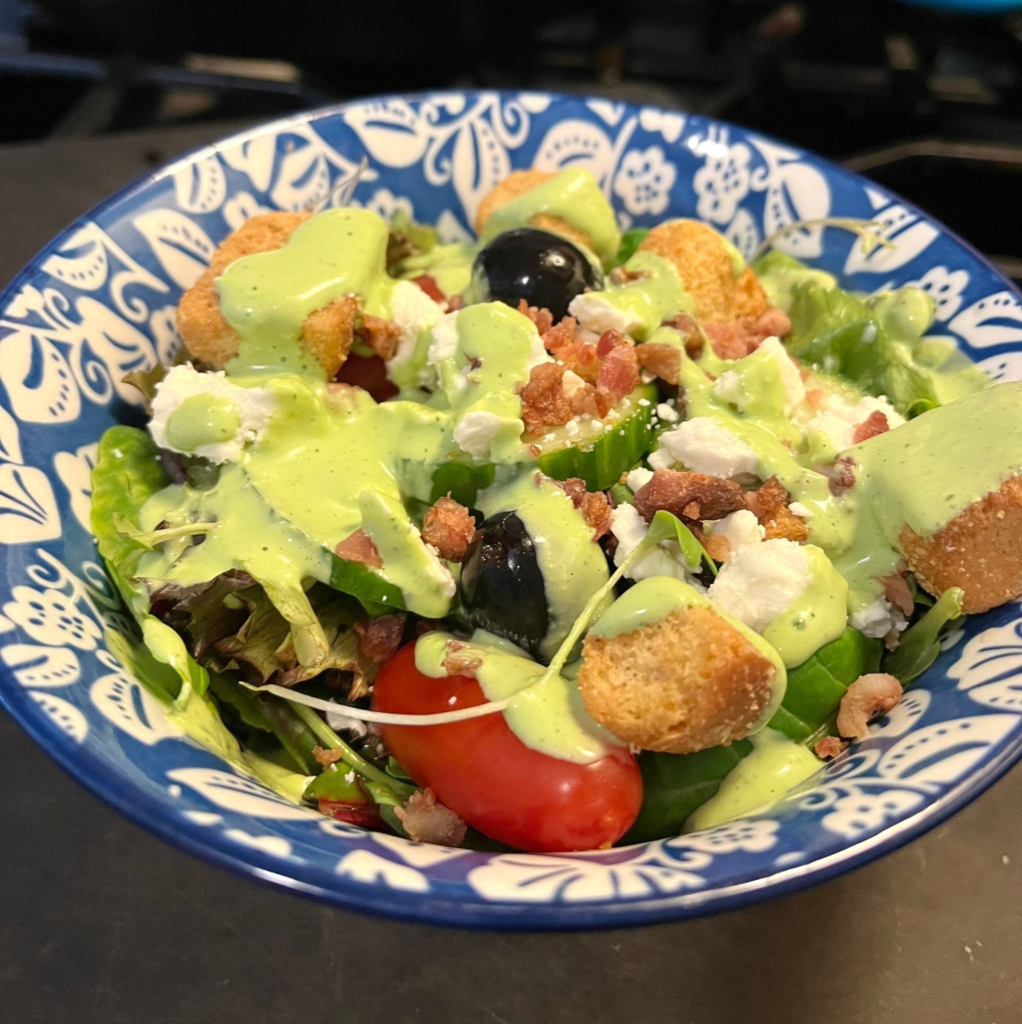 Homemade green goddess dressing with garden herbs