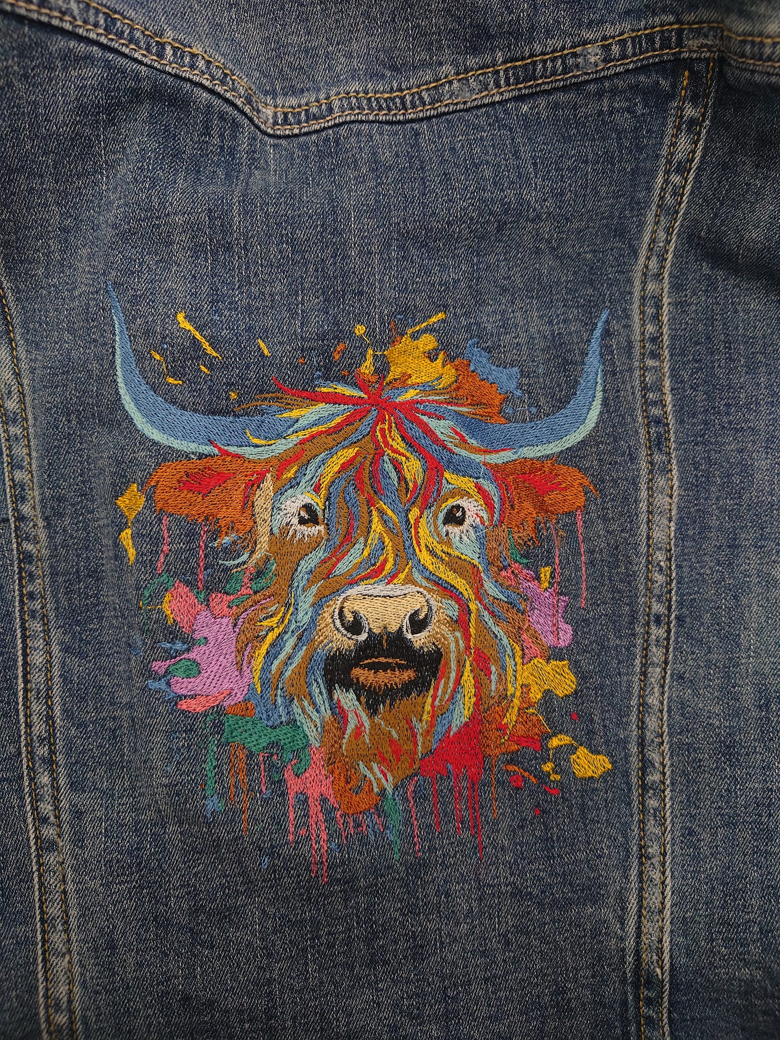 Denim jacket upcycled with custom embroidery design