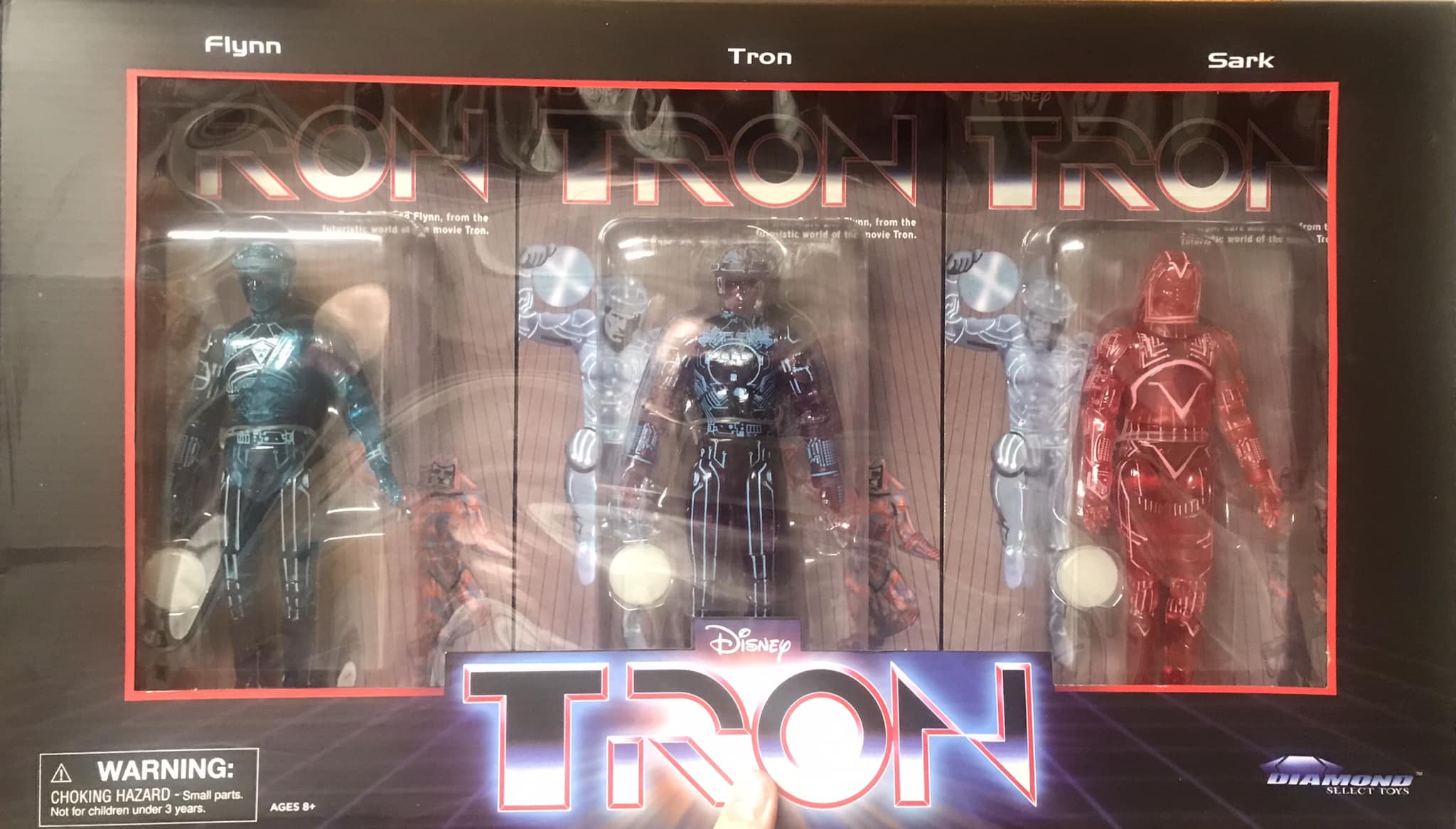 Classic Tron deluxe action figure set with arcade style packaging