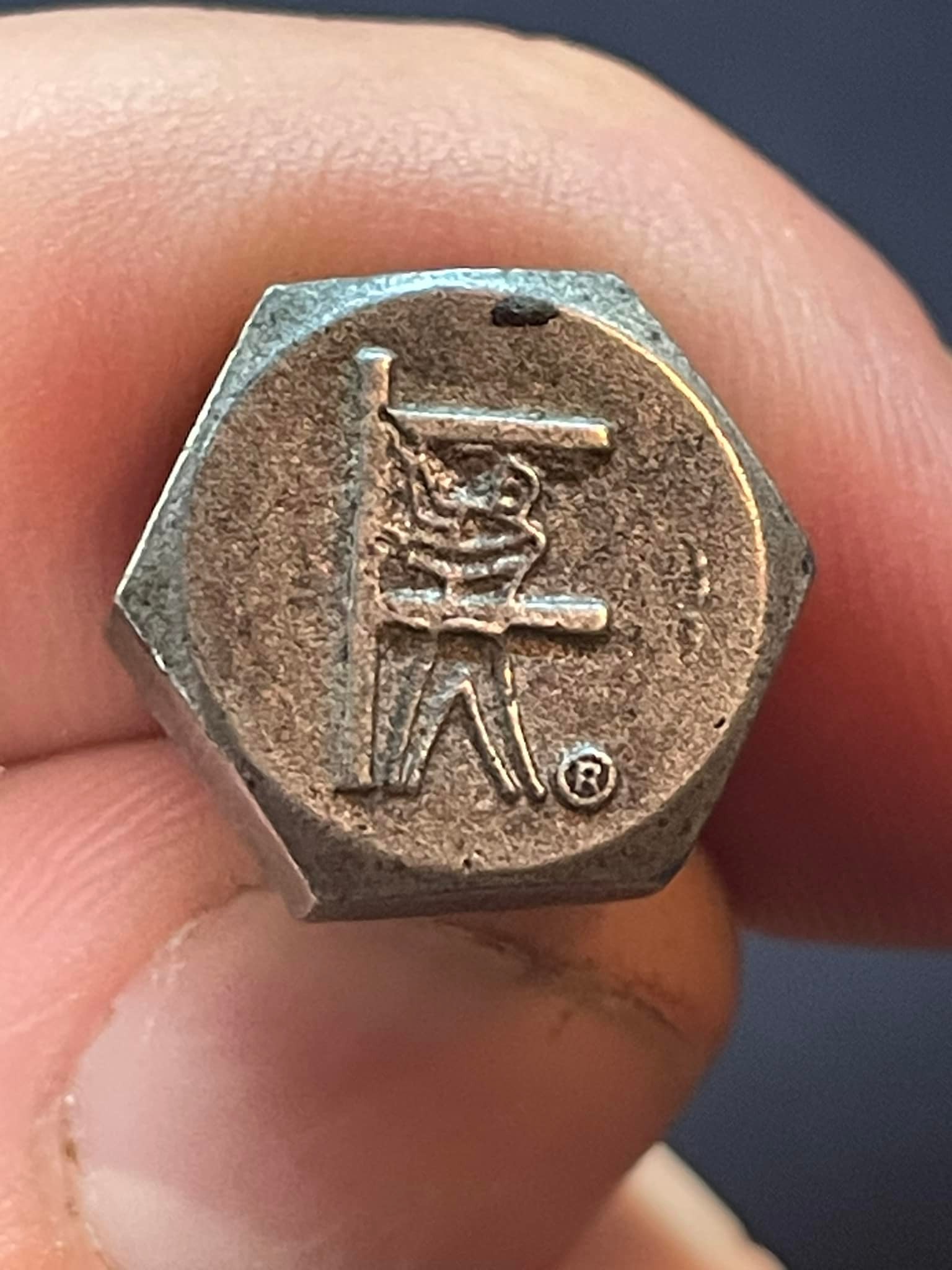 What is the origin and meaning of the marking on this old bolt?
