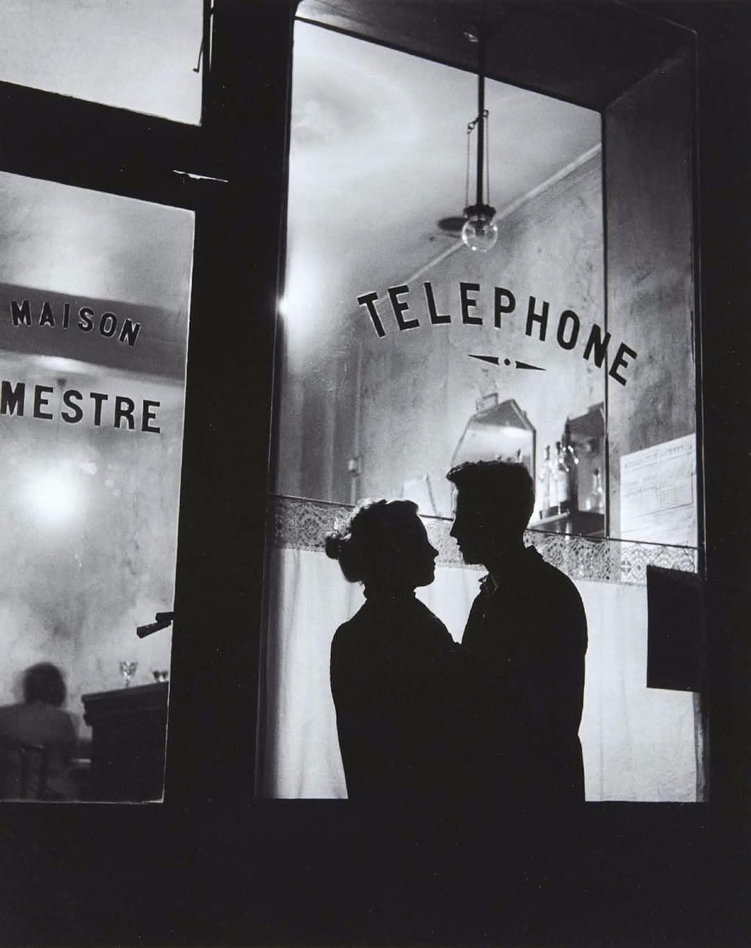 A Street Scene, Paris 1957. Photo by Willy Ronis