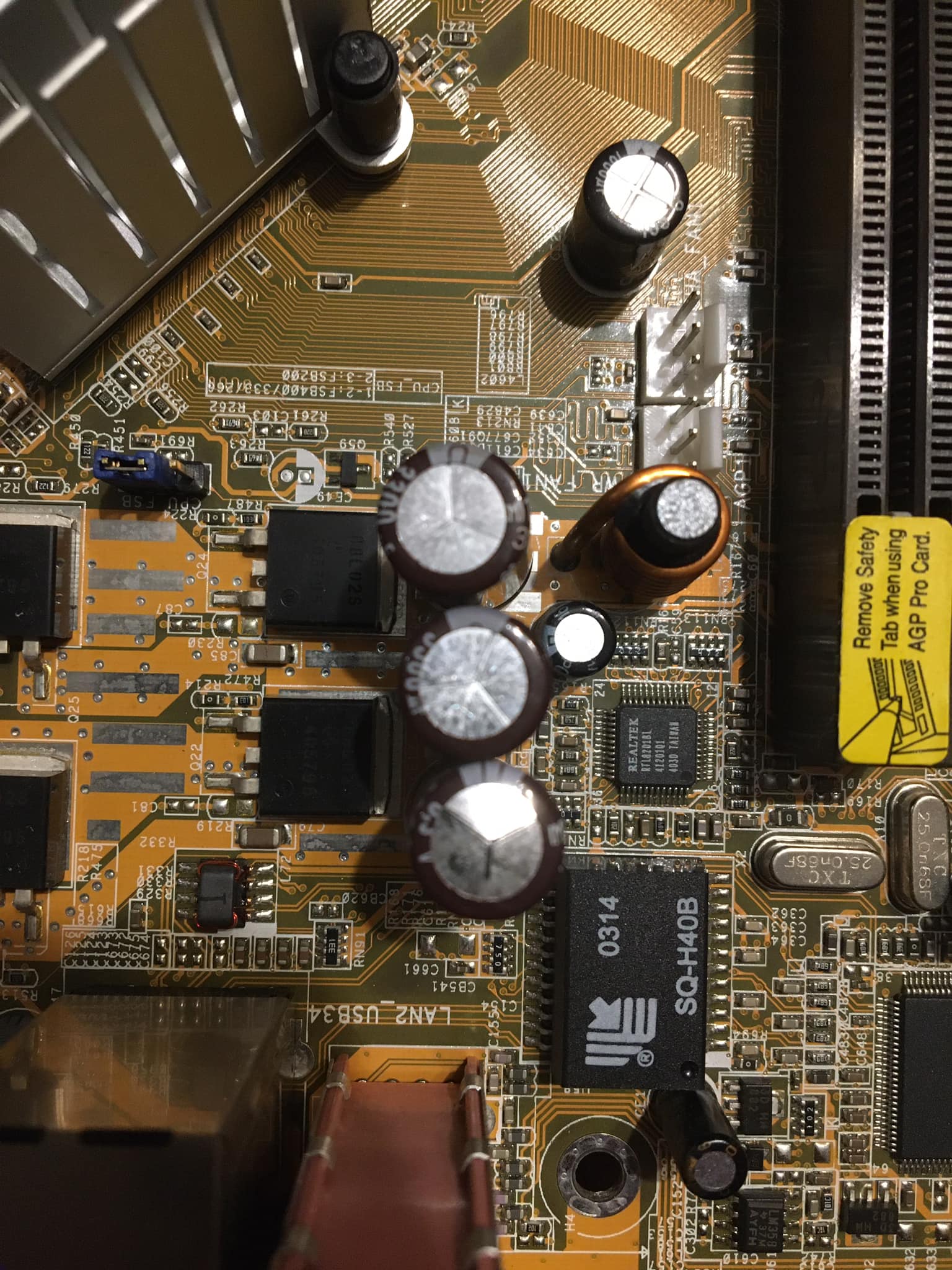Replacing bloated capacitors on an Intel i815 motherboard