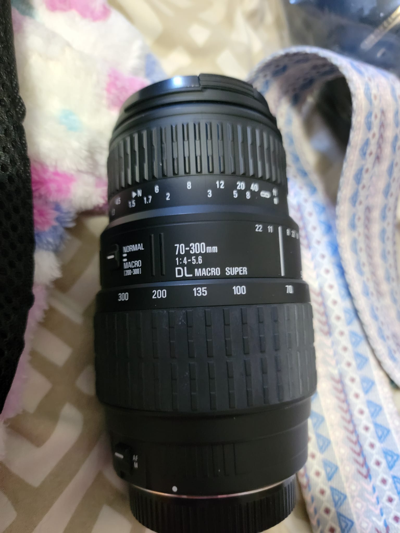 Is there an adapter to use a Sigma 70-300 DL macro super lens on a 