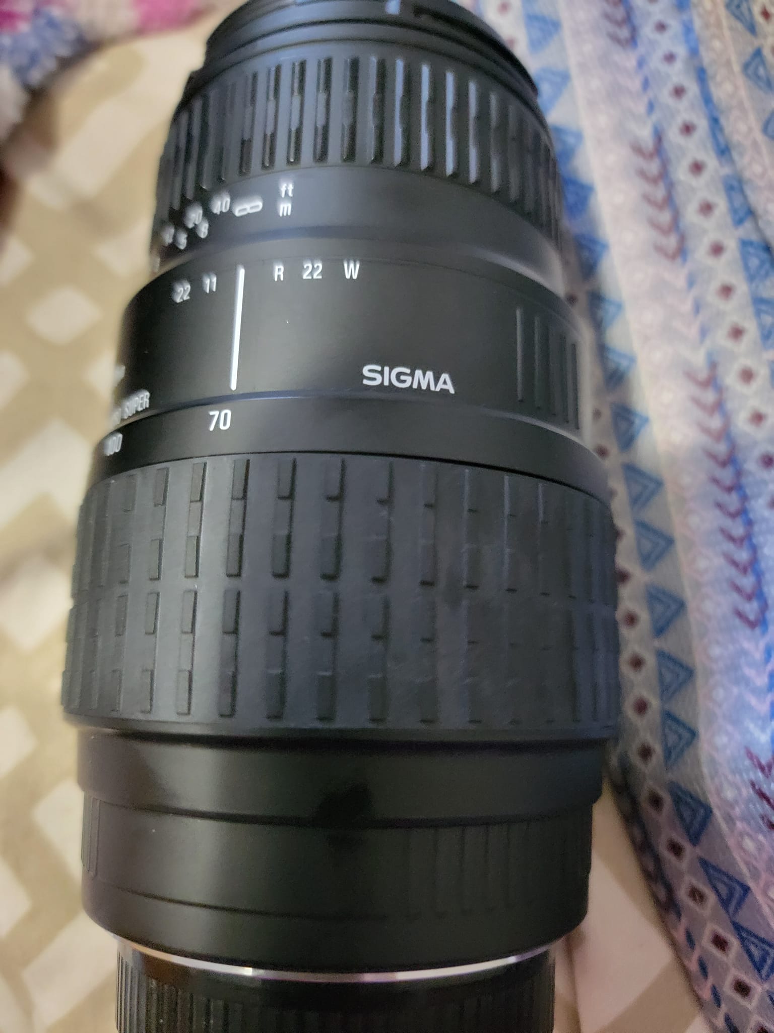 Is there an adapter to use a Sigma 70-300 DL macro super lens on a 