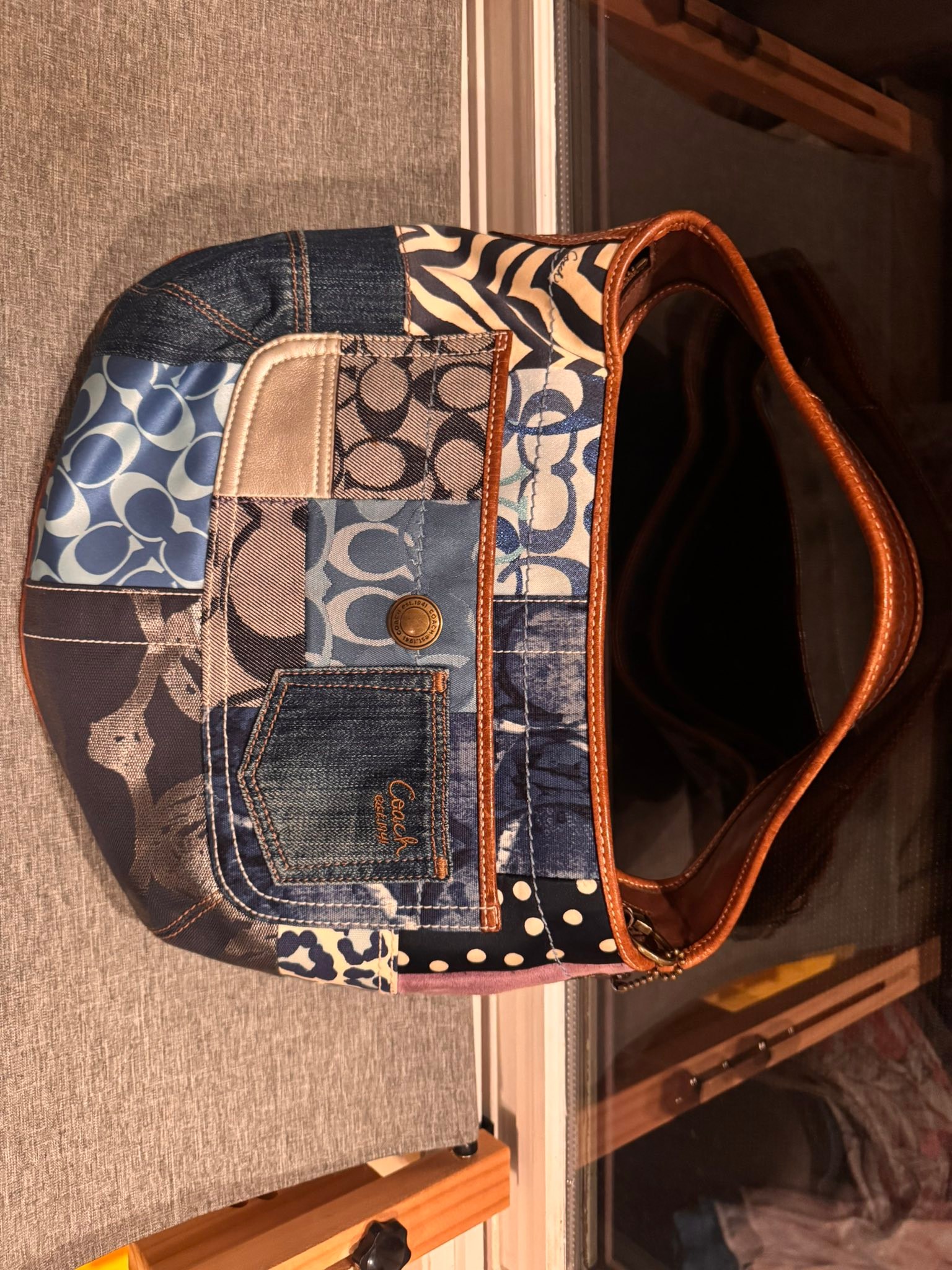 Coach patchwork hobo shoulder bag featuring a mix of denim 