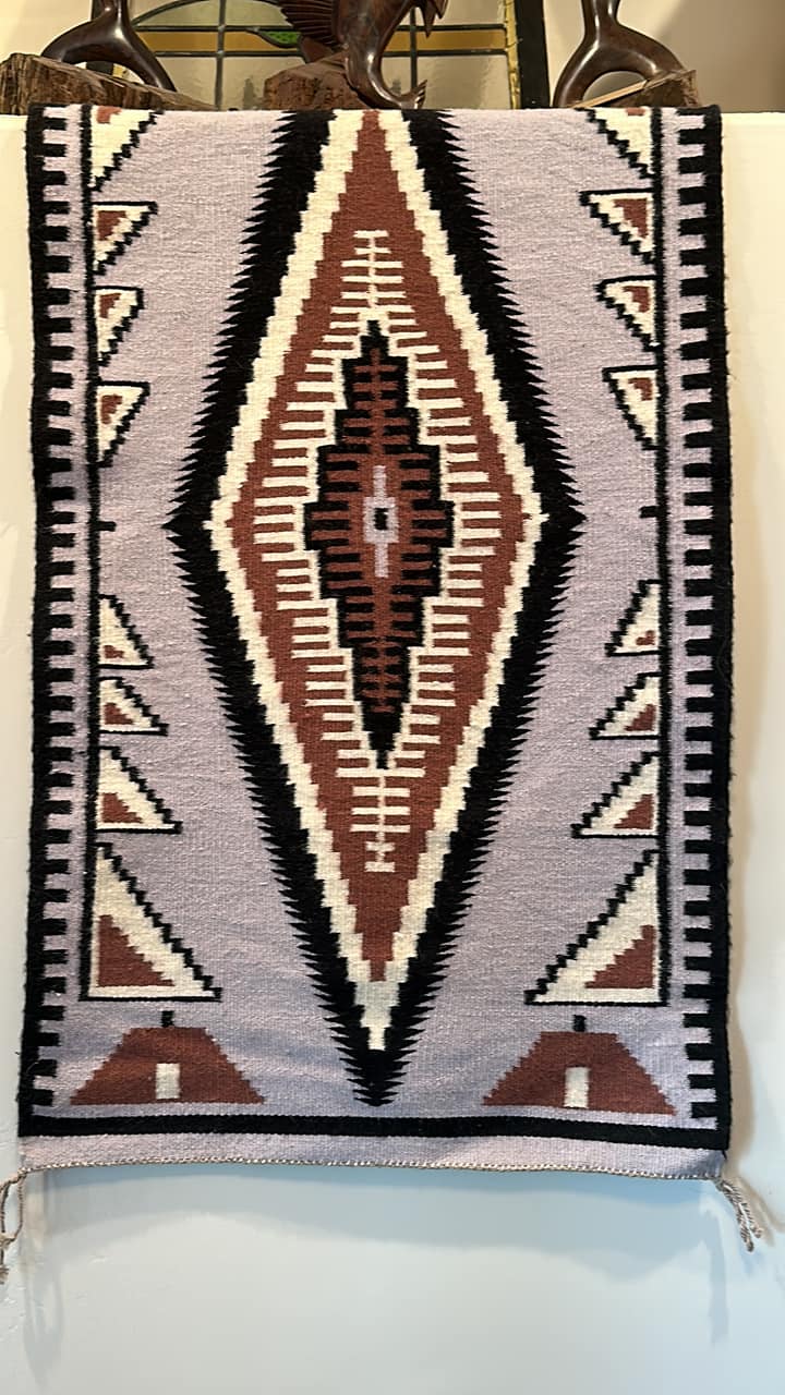 A vintage rug/tapestry by the artist “Tere” Teresa Gonzalez, found