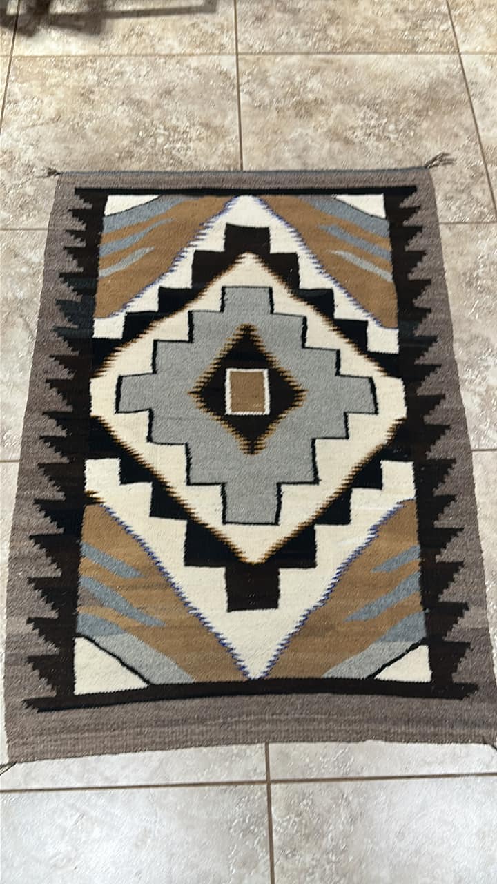 A vintage rug/tapestry by the artist “Tere” Teresa Gonzalez, found