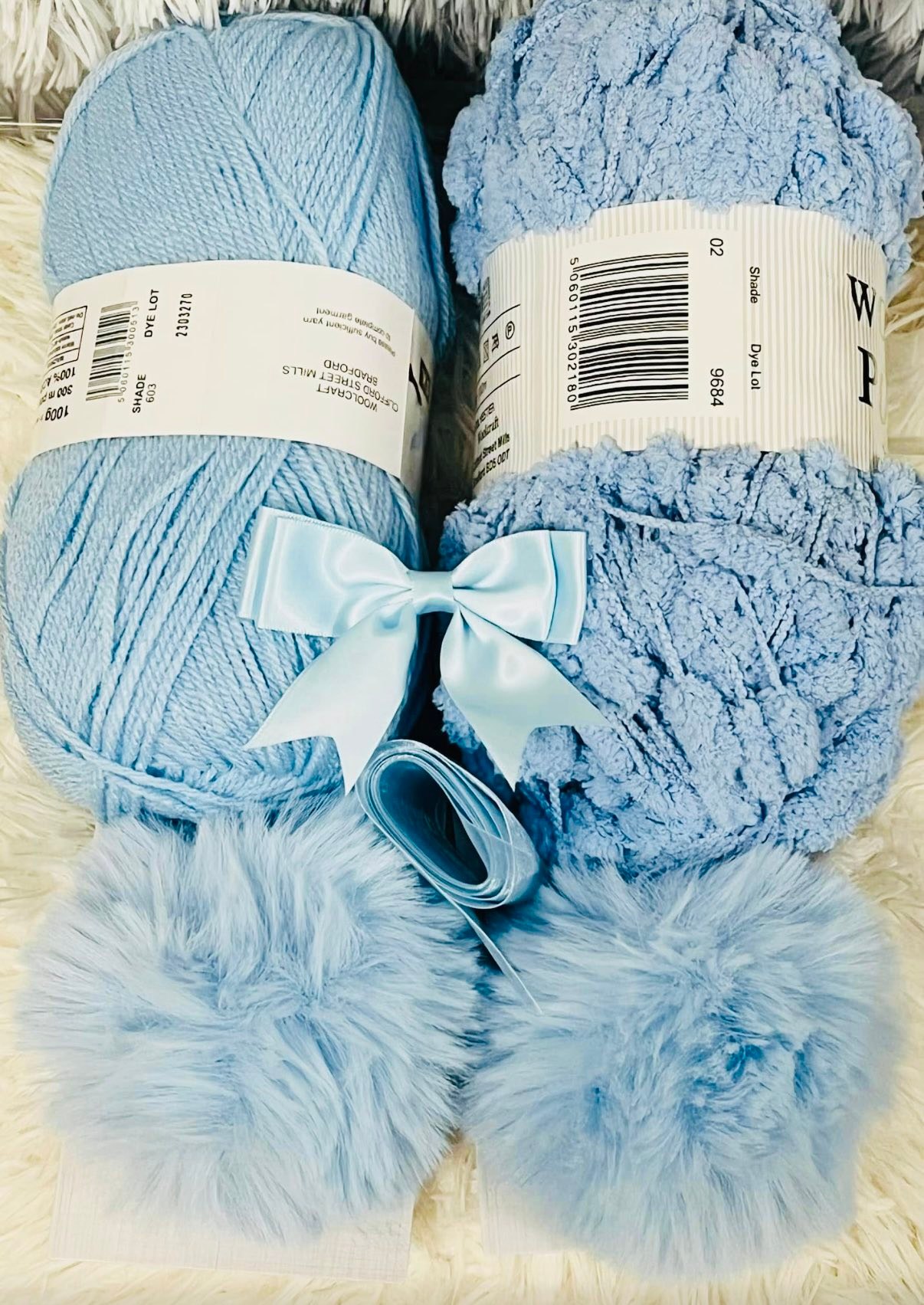 Beautiful Pom Pom blankets with matching faux fur Pom Pom hats