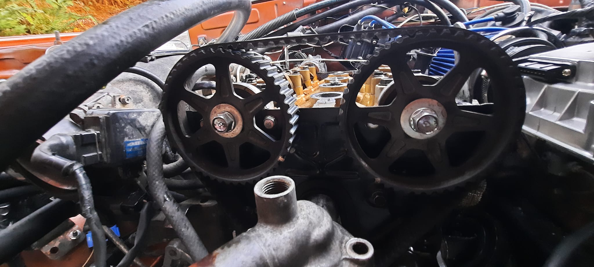 What is the correct timing belt tension for 1985 NA?
