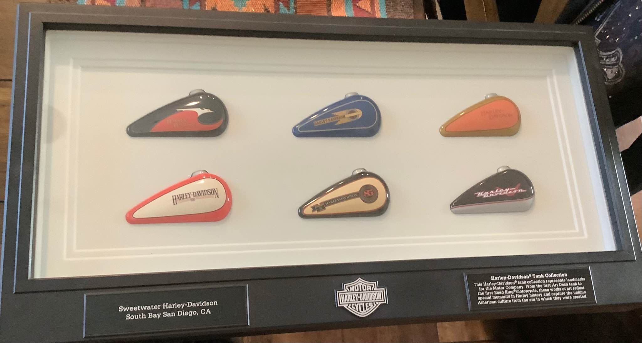 Framed Harley-Davidson tank collection features six miniature