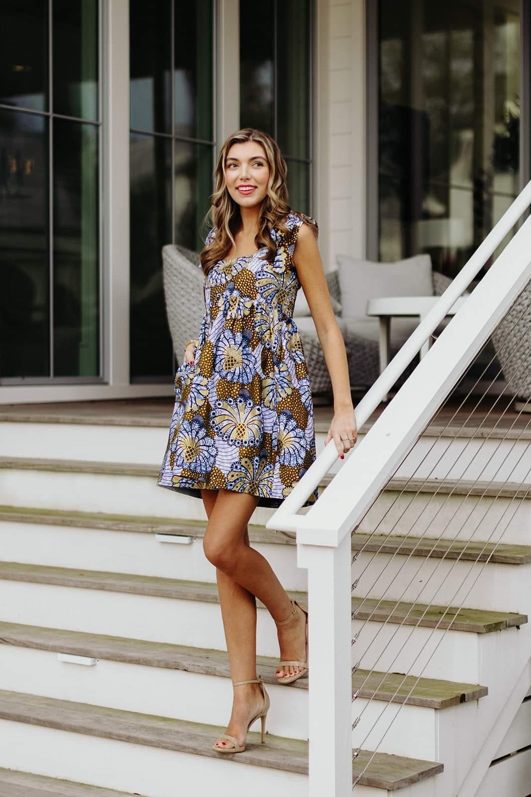 The Neve Tie Mini Dress could possibly be your new go-to dress. Ties at the shoulder. Elastic back. Super cute! Worn with or without tights or leggings! Worn with or without a