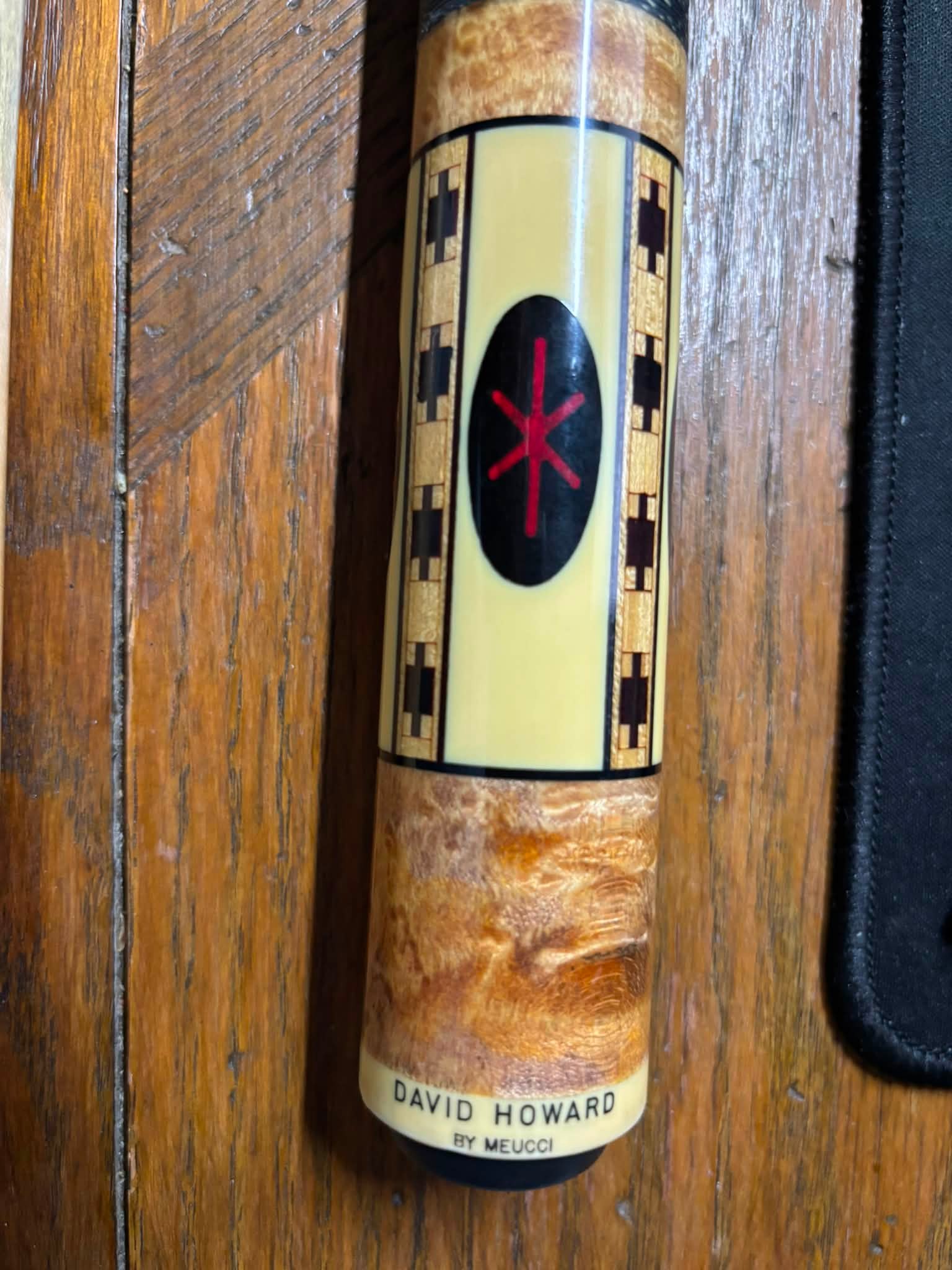 What is the value of a David Howard Meucci cue with hairlines in