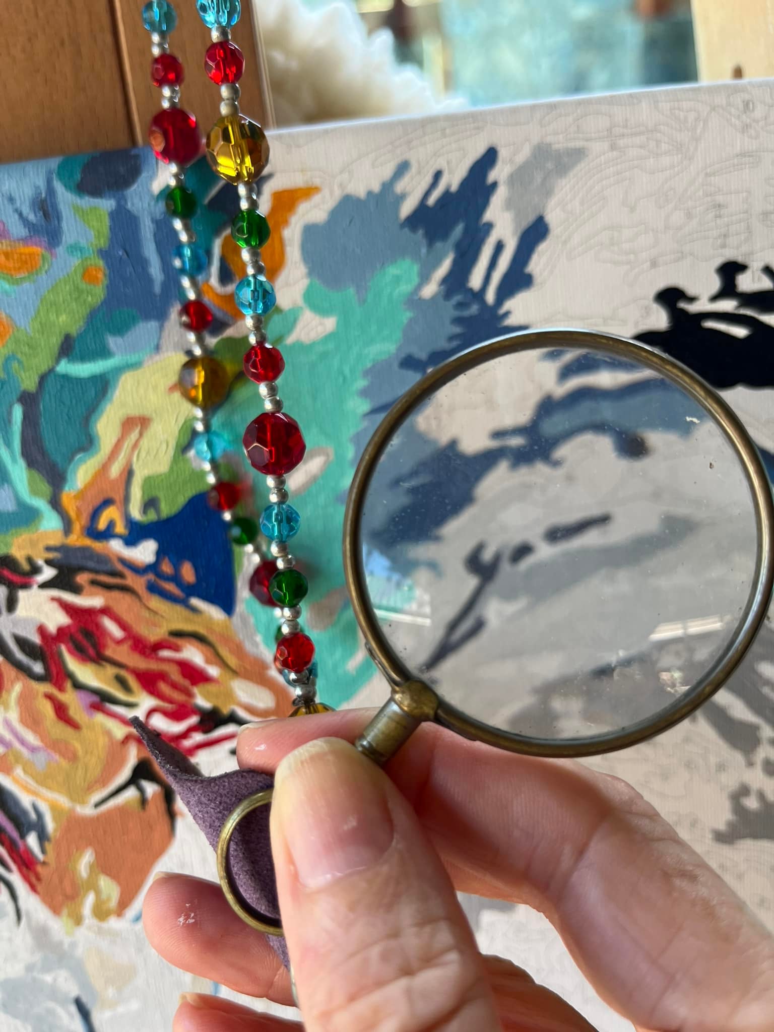 Paint by numbers under magnifying glass