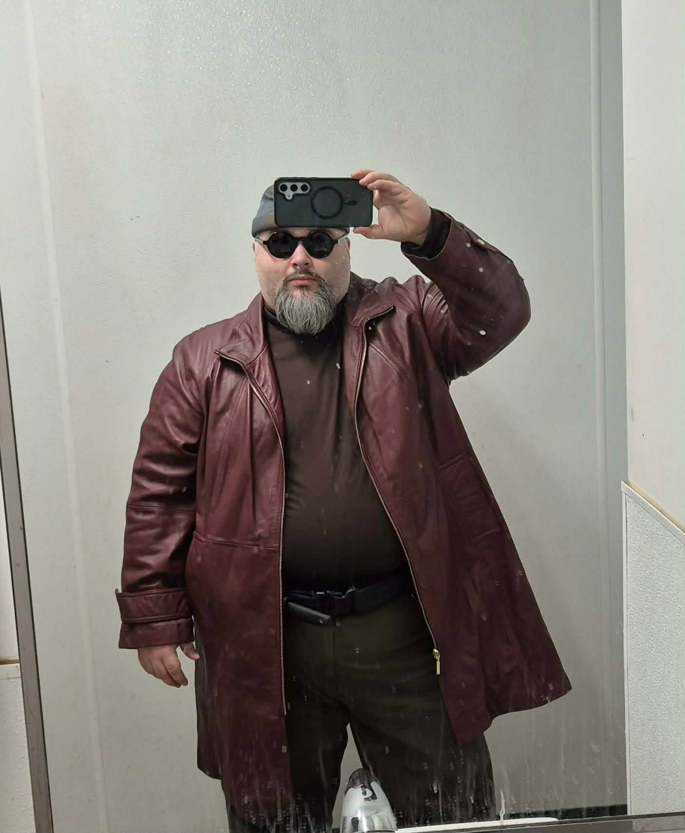 Cyberpunk inspired outfit with y2k era leather trench