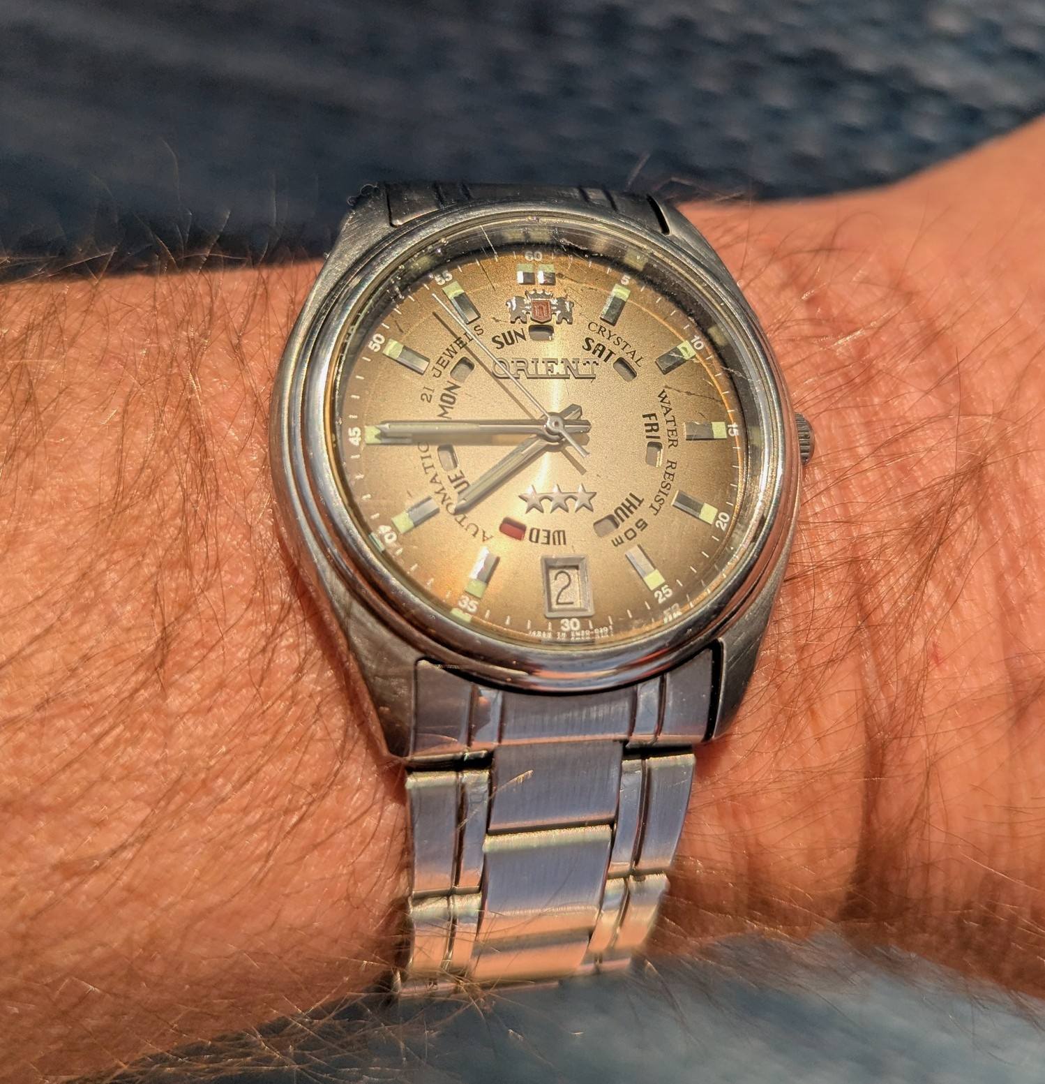 Restored vintage Orient watch EM5J-CO CA with red/blue date wheel