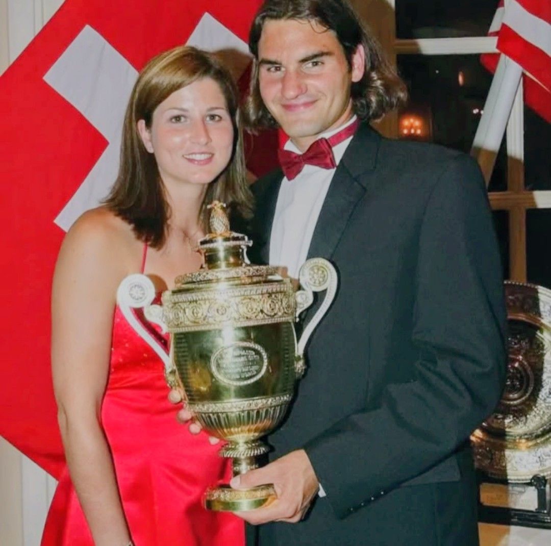 Roger Federer is sitting alone in the Royal Box, watching the
