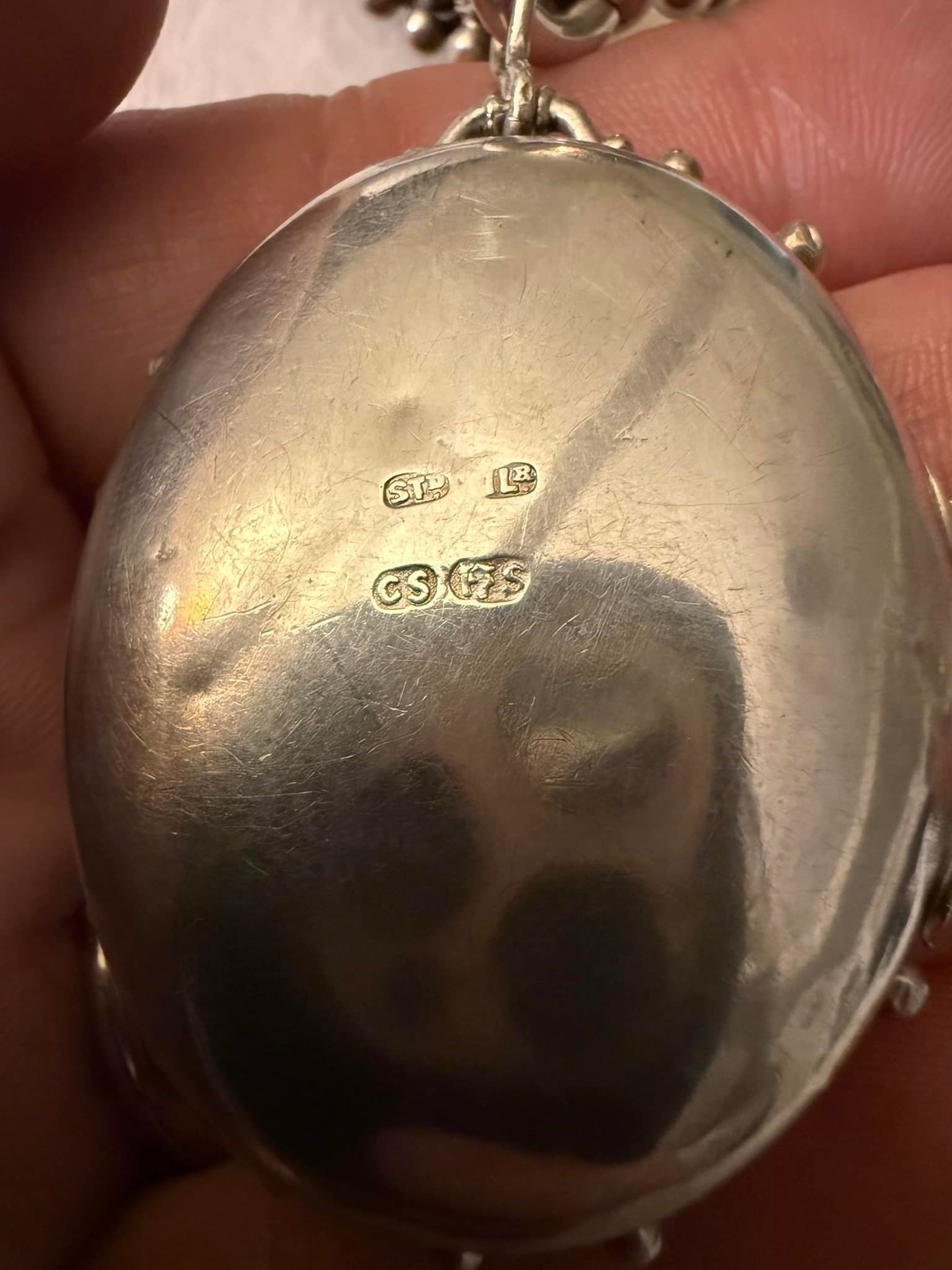 What do Victorian necklace and locket markings mean?