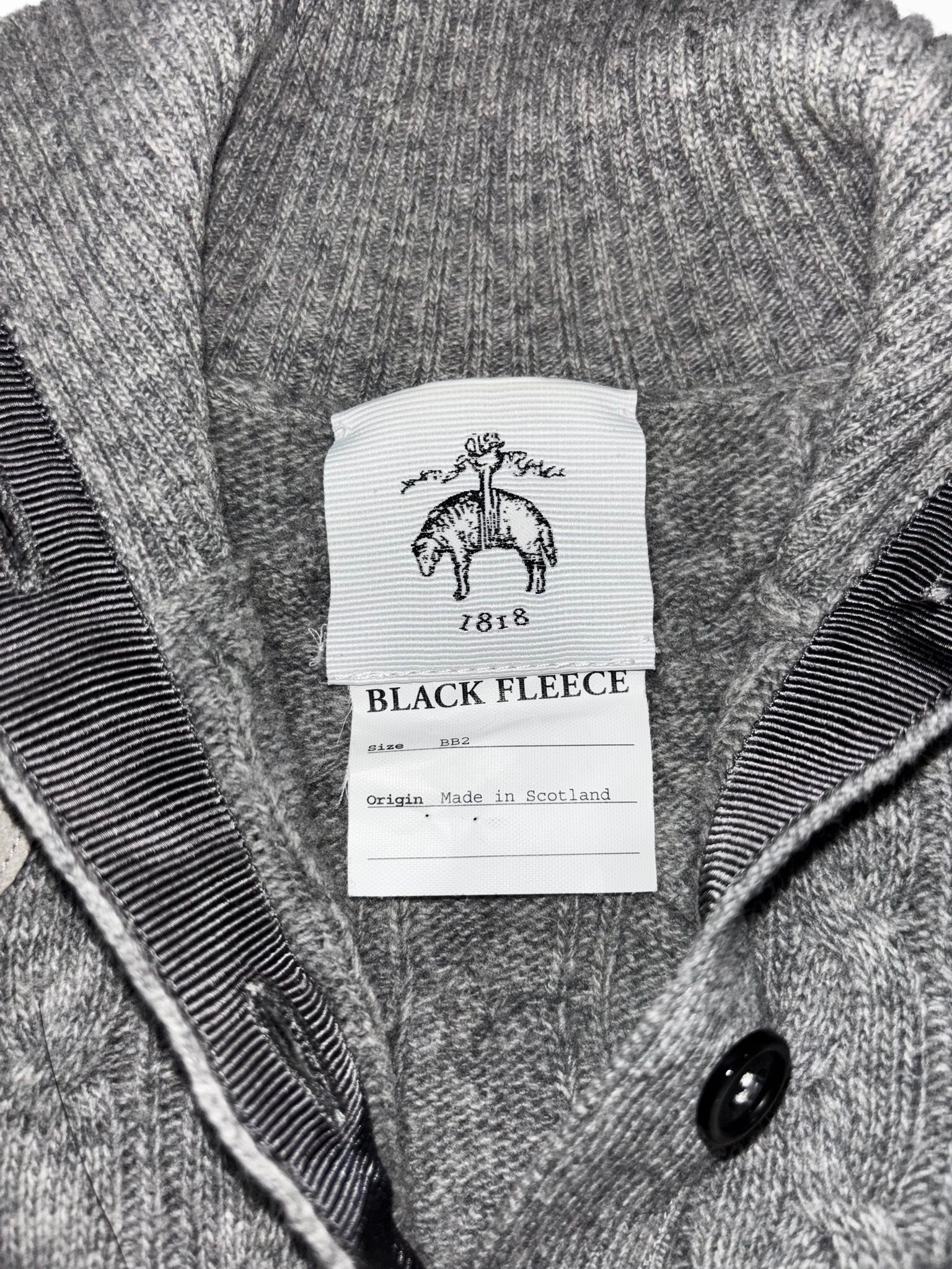What's the price of a Brooks Brothers black fleece lambswool cardigan?
