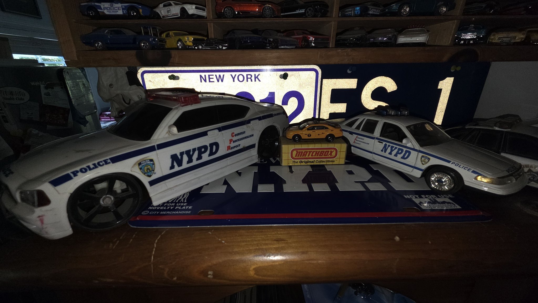 Some nypd cars of various sizes