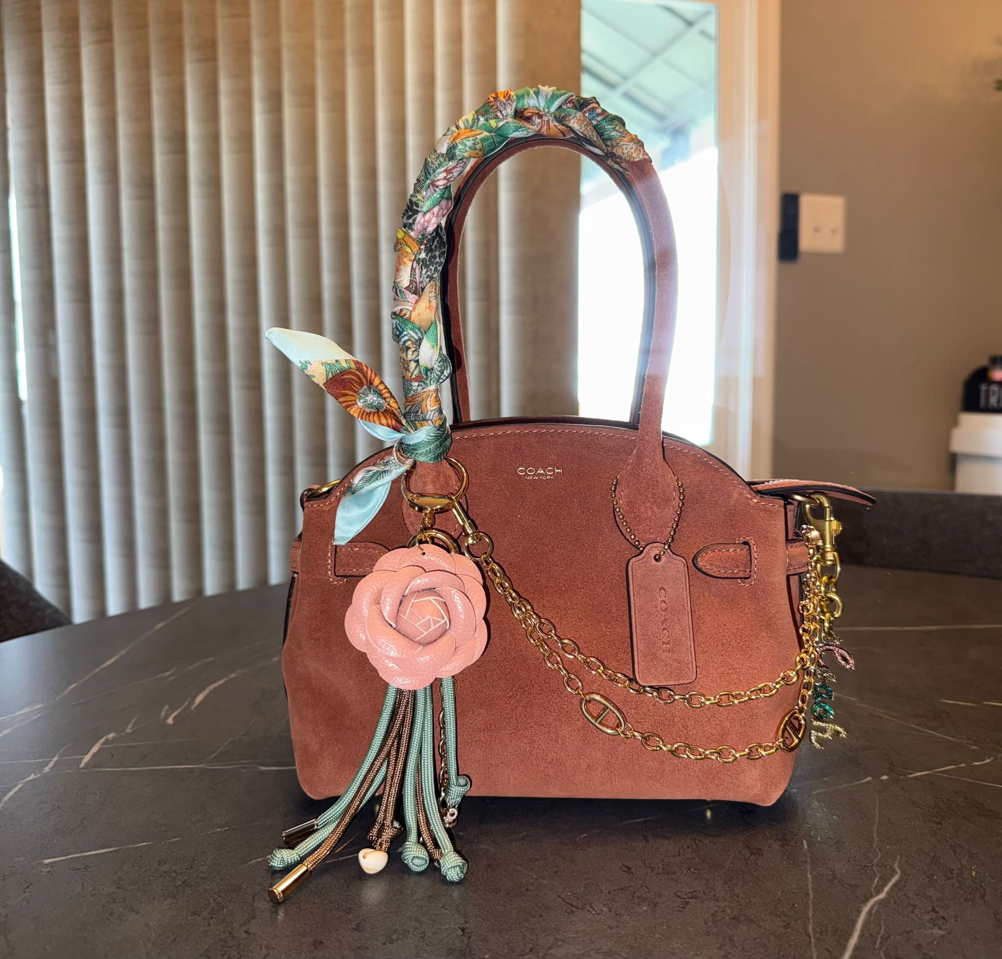 Styling a new Coach bag with scarf wrapping