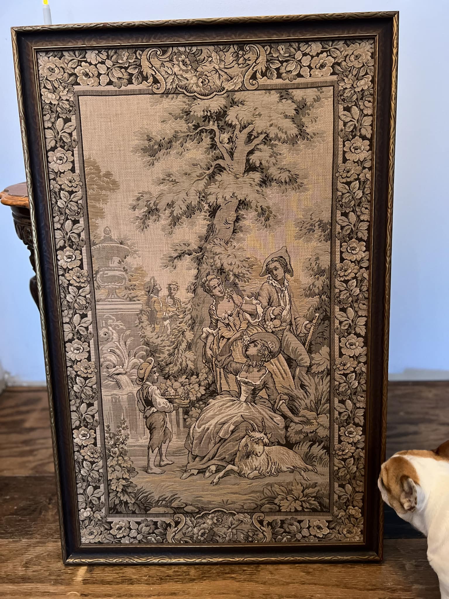 What is the origin and value of this antique framed tapestry?