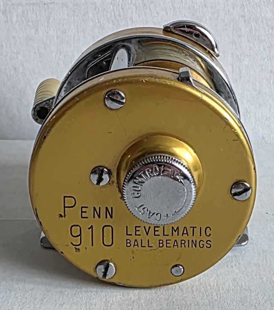 Vintage Penn 910 Levelmatic baitcasting reel has gold anodized