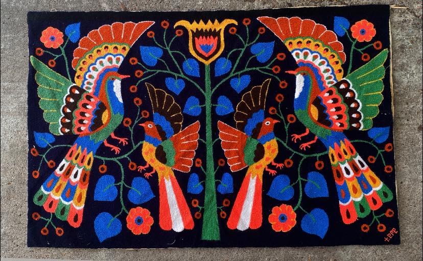 A vintage rug/tapestry by the artist “Tere” Teresa Gonzalez, found