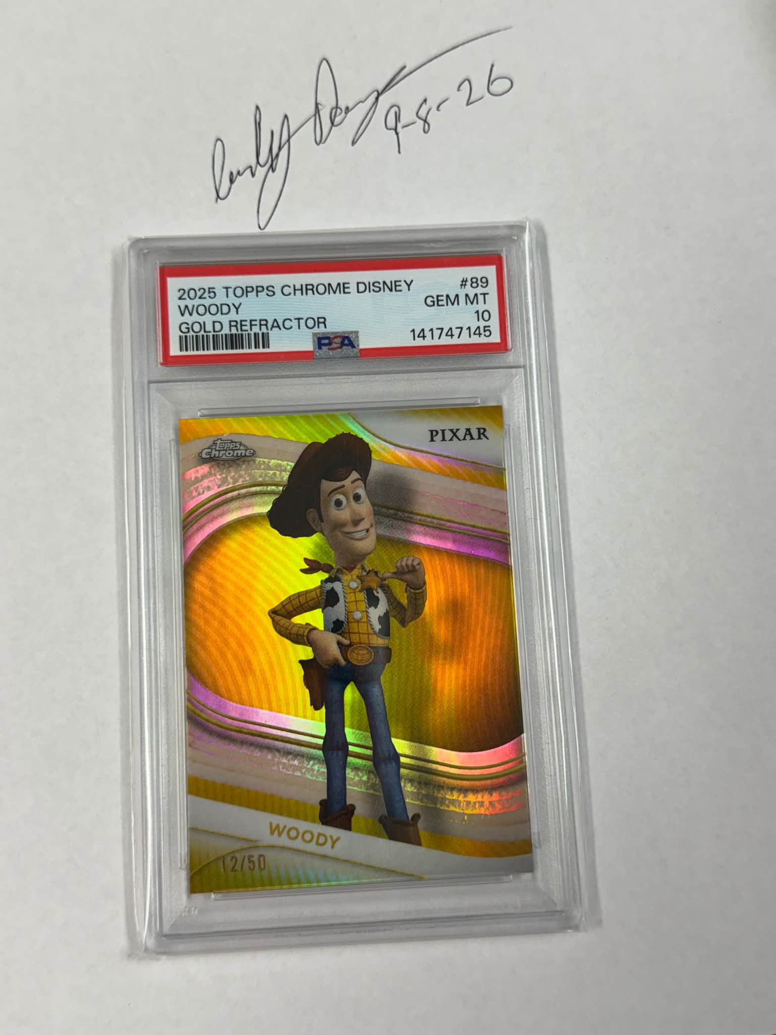 2025 Topps Chrome Disney #89 Woody Gold Refractor 12/50 - PSA 10