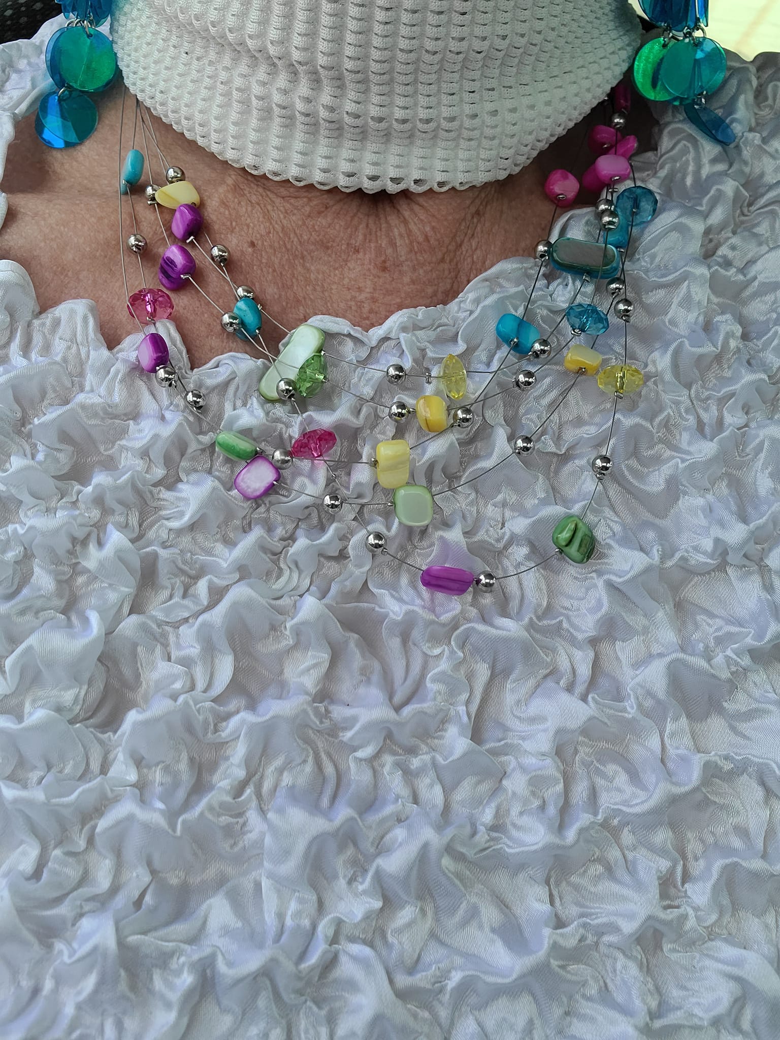 Wearing white with colorful Paparazzi jewelry