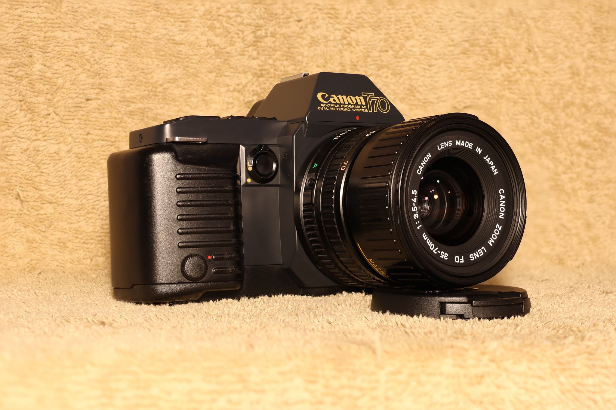 Canon T70 35mm camera with 35-70mm lens and 50mm f/1.8 FD lens