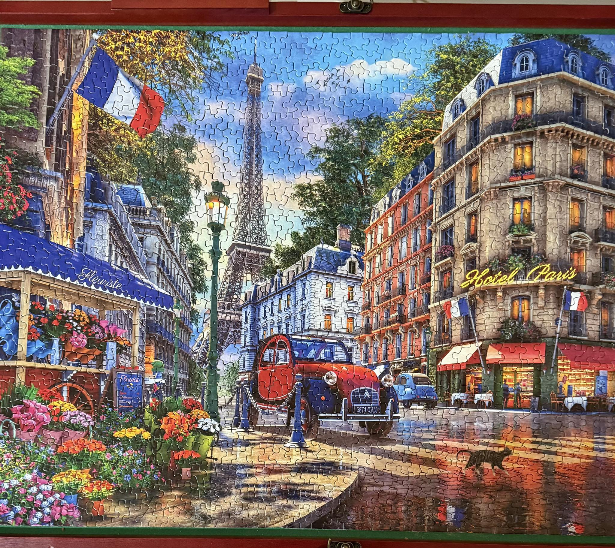 1000 piece Springbok puzzle named “Paris Street Life. “ It was