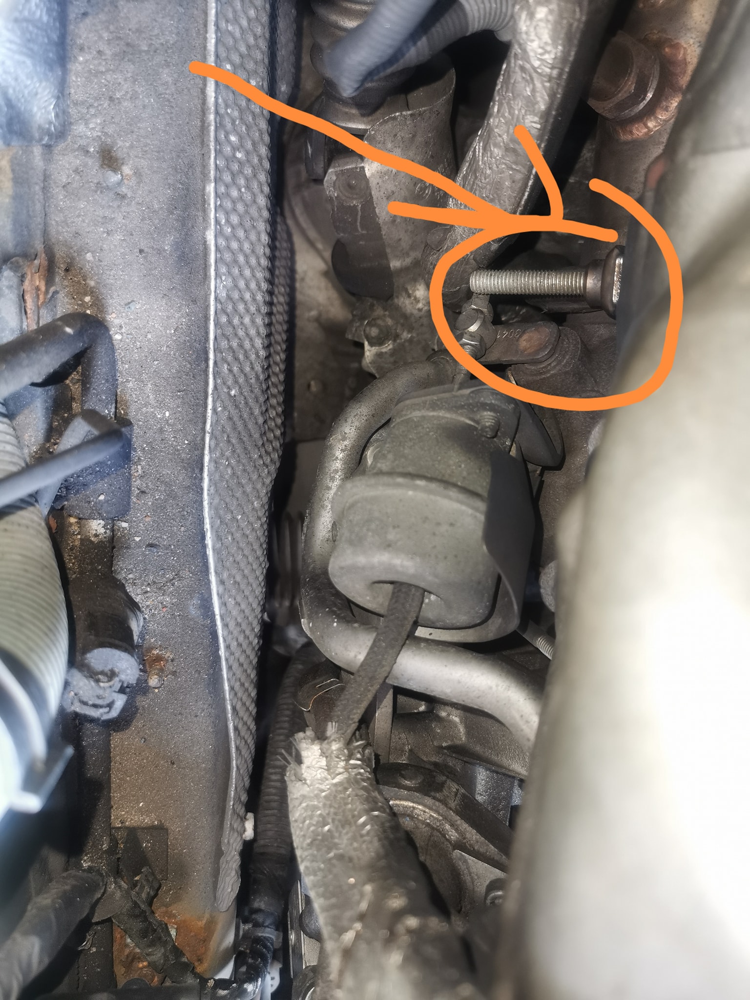 What is the random bolt next to the turbo wastegate actuator on a