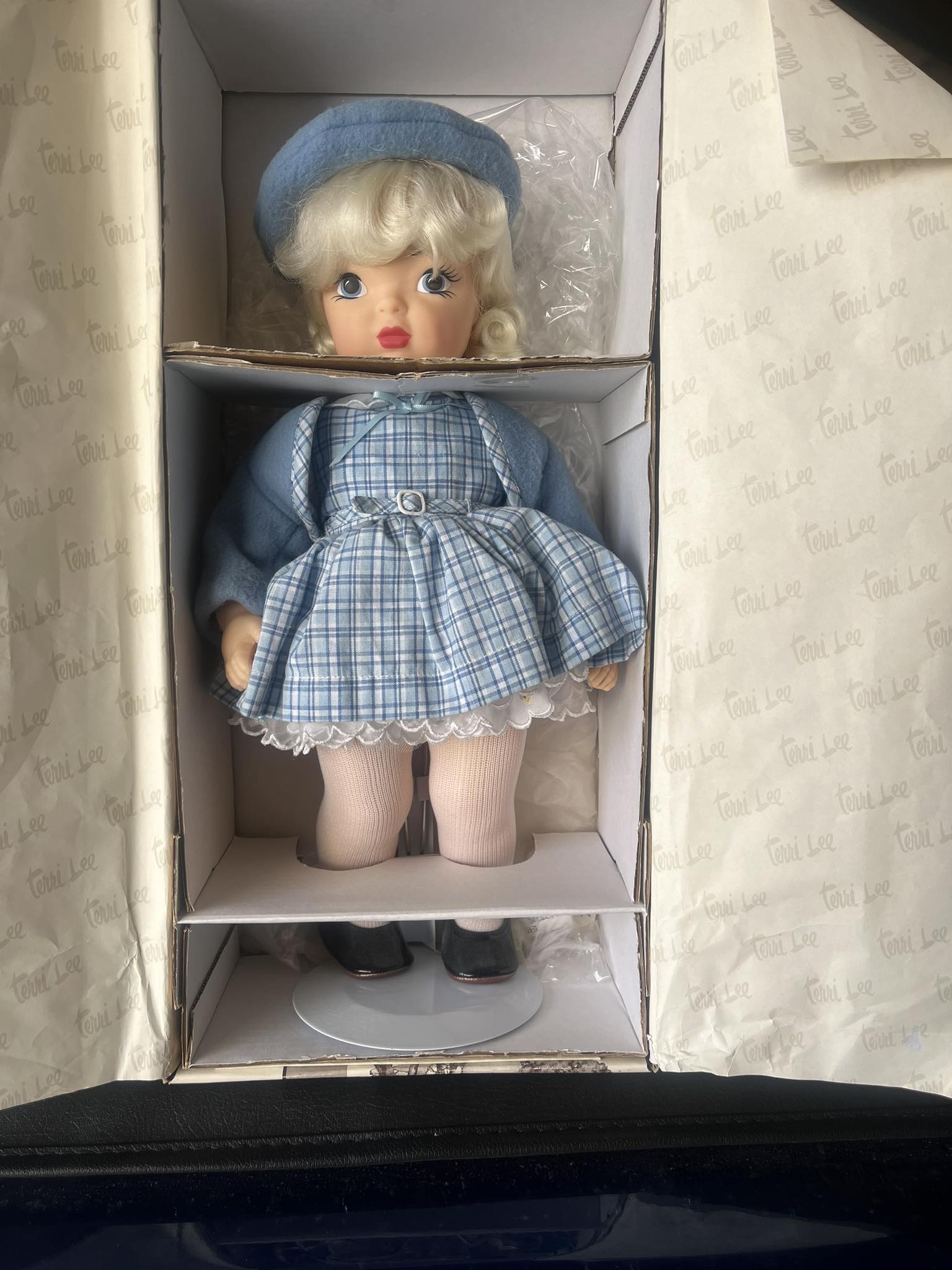 Terri's Dolls miniature porcelain doll in a dollhouse