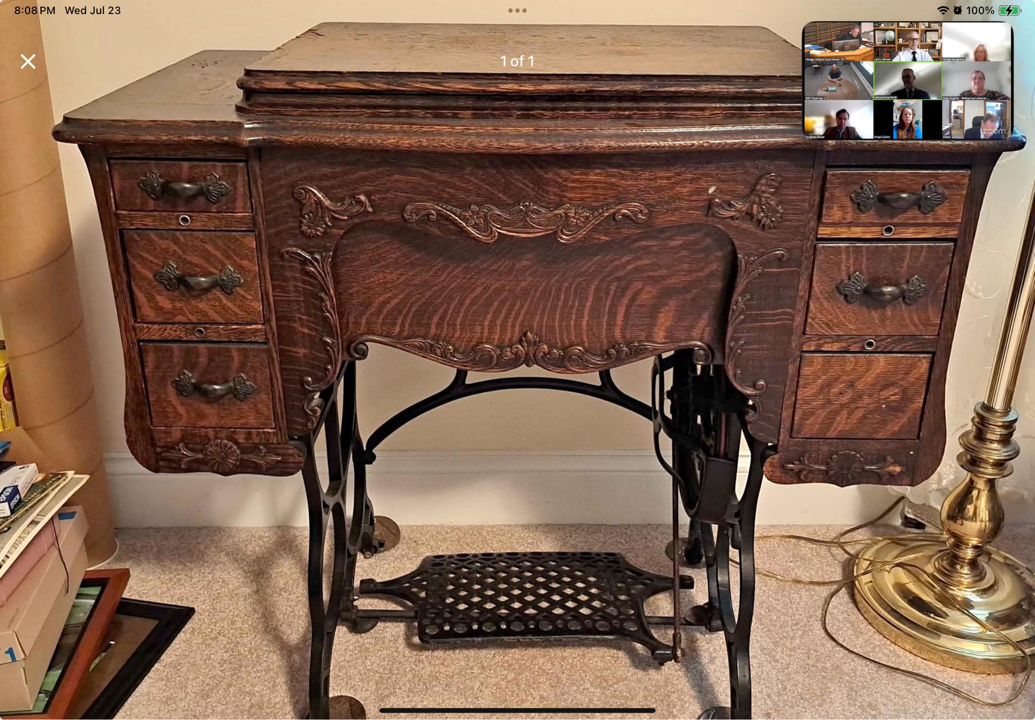 What brand is this vintage sewing machine cabinet?