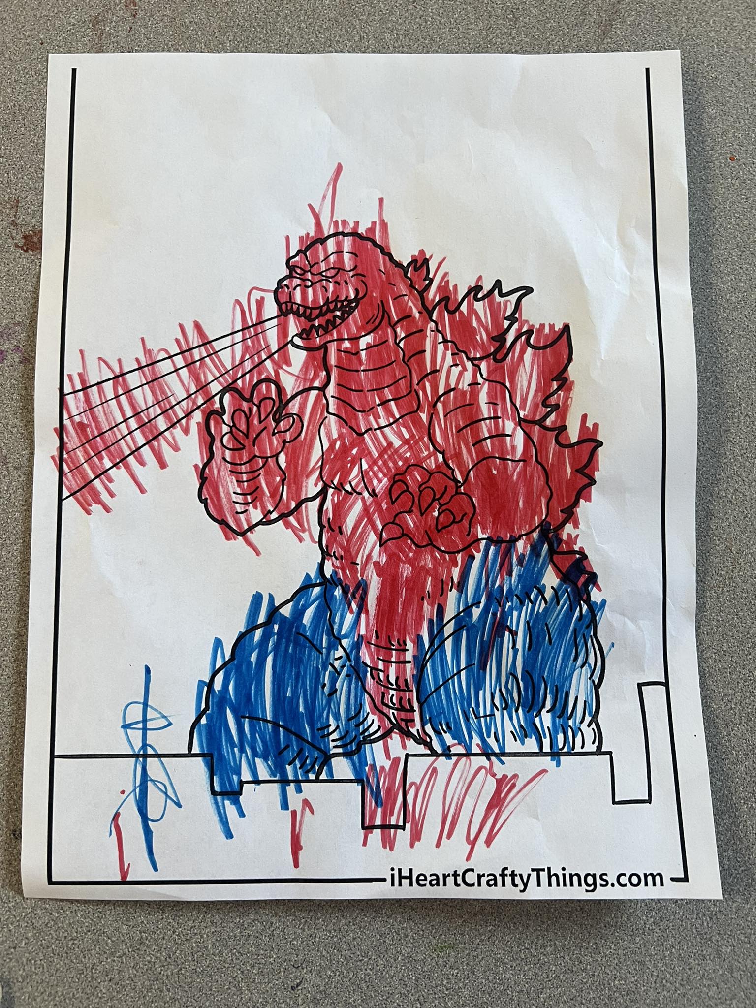 Child's Godzilla drawing in art class