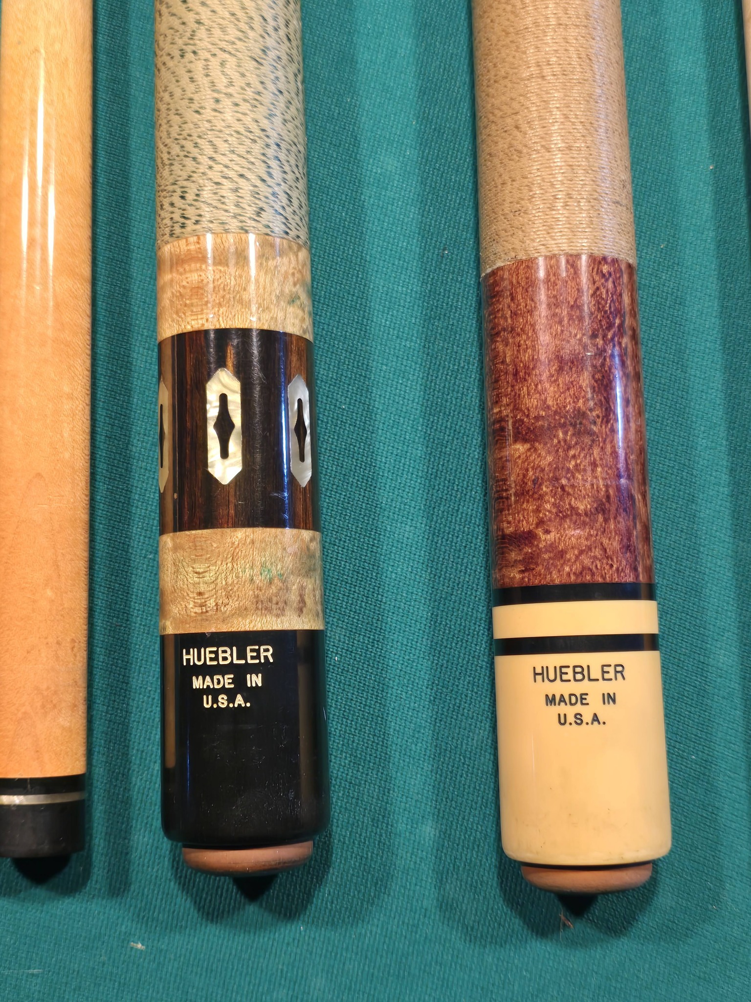 What are Huebler pool cues' models and values?