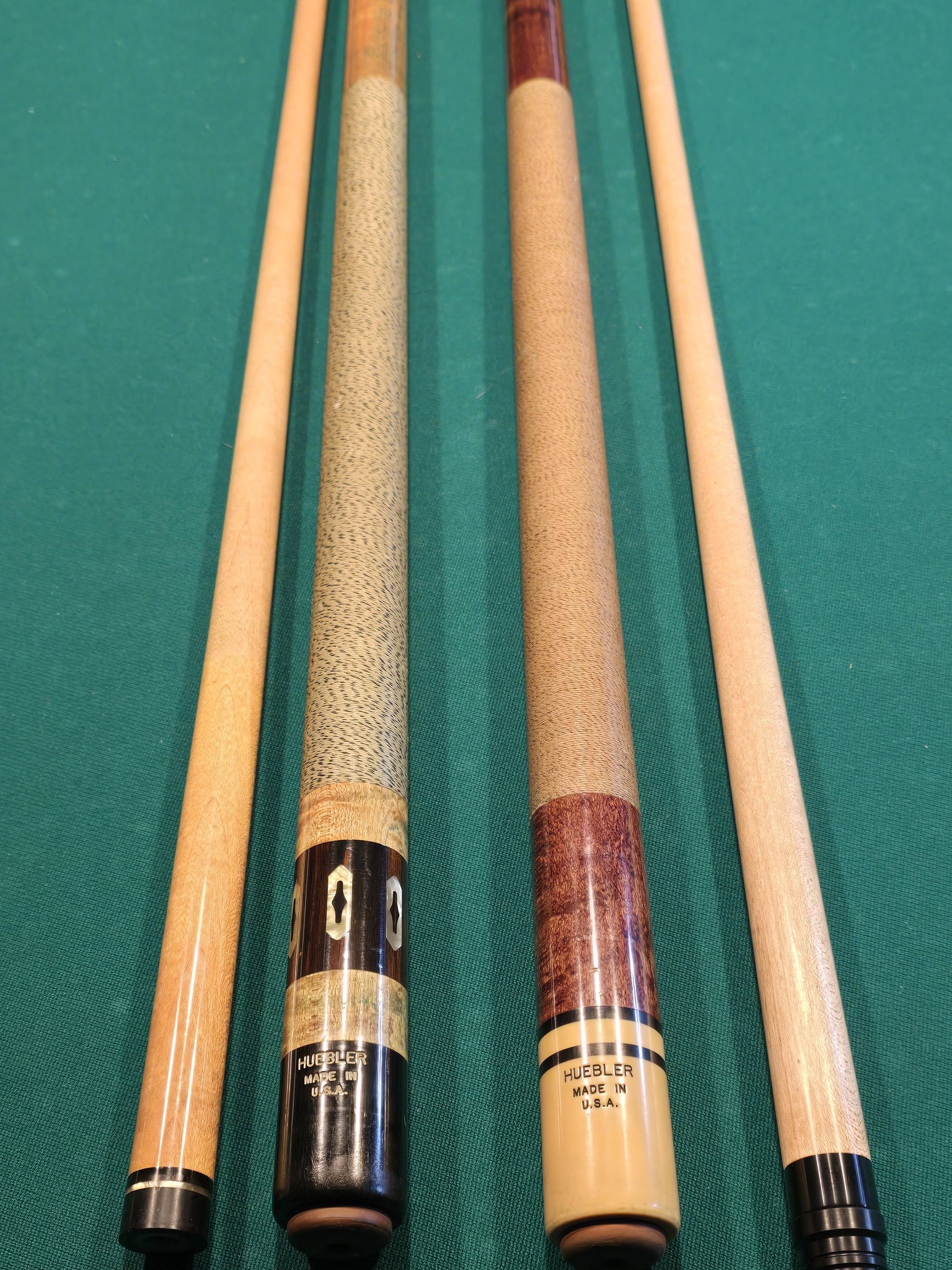 What are Huebler pool cues' models and values?