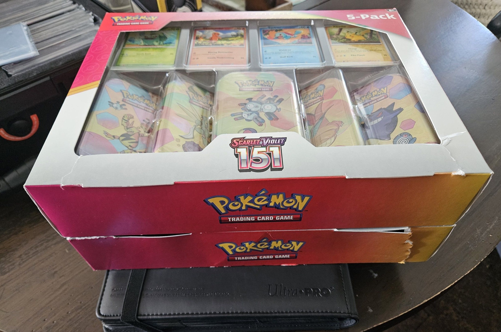 pokemon trading cards costco Prismatic Evolutions 8-Pack Mini Tins and a Pokemon art card showing art from the mini tin For all the Pokemon TCG