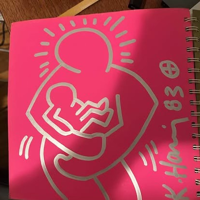 Keith Haring autographed catalog with custom drawing