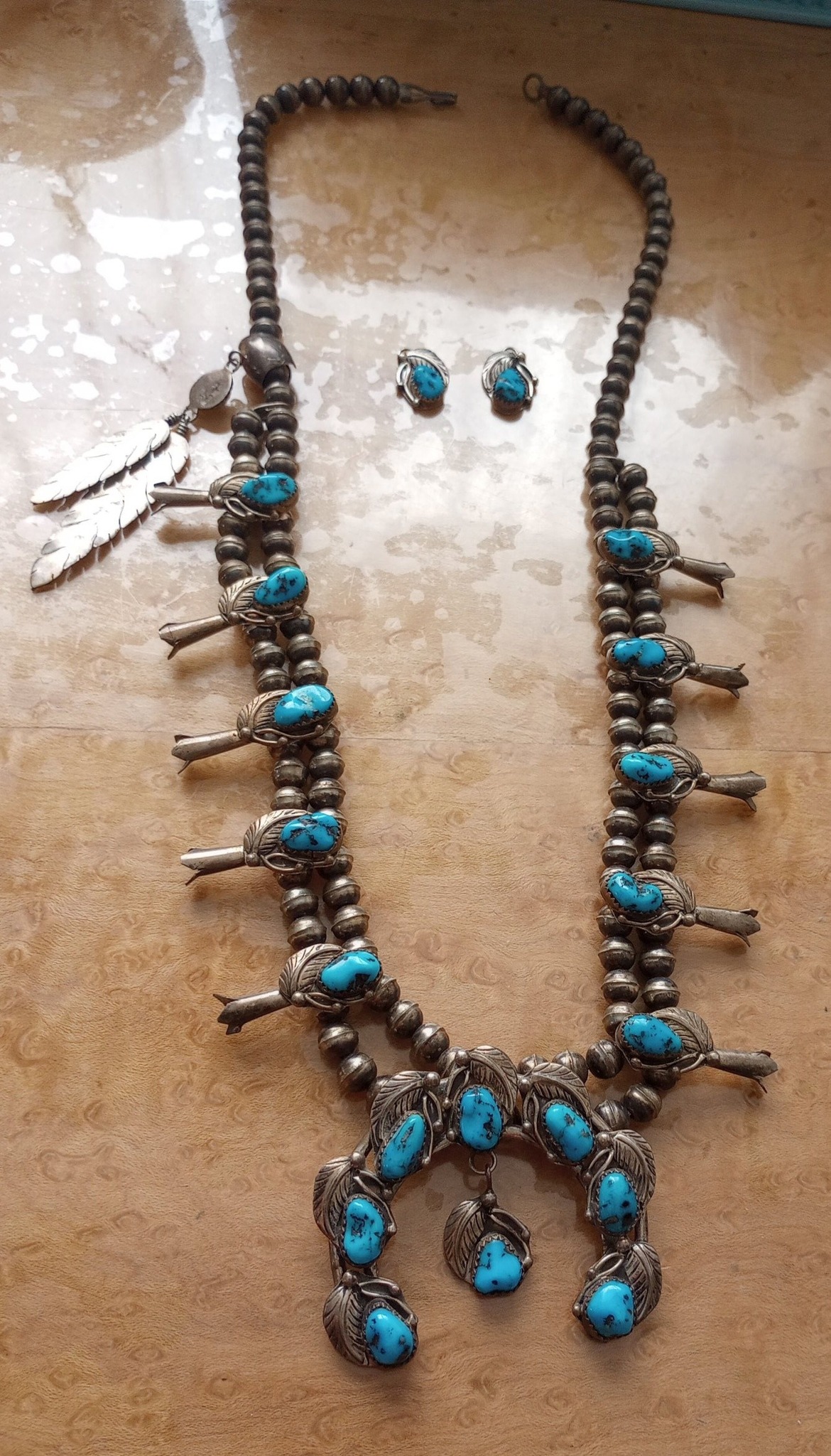 What is the hallmark on a 1990's 50 strand Navajo liquid silver