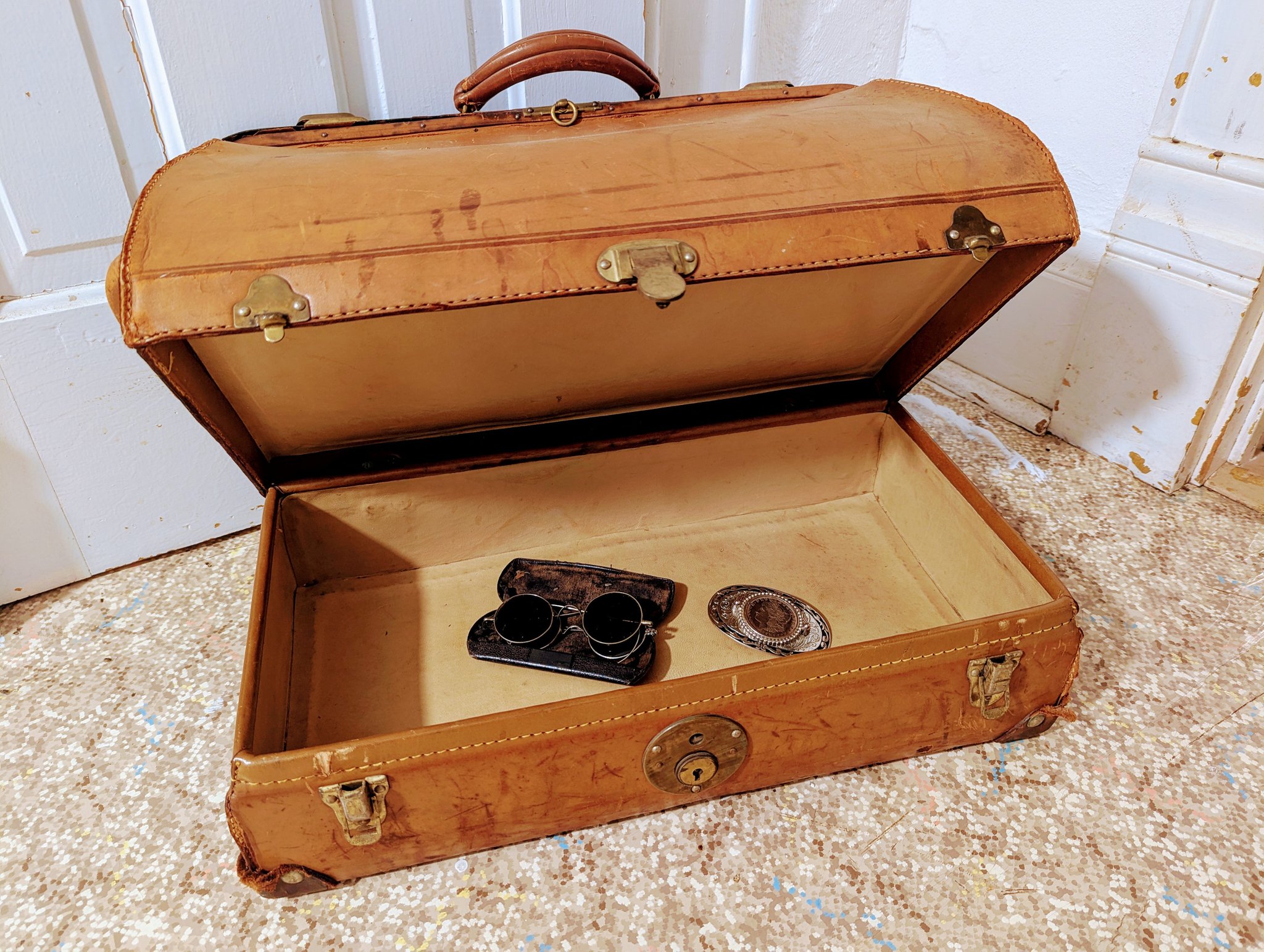 Unique antique luggage found in Iowa with hidden compartment