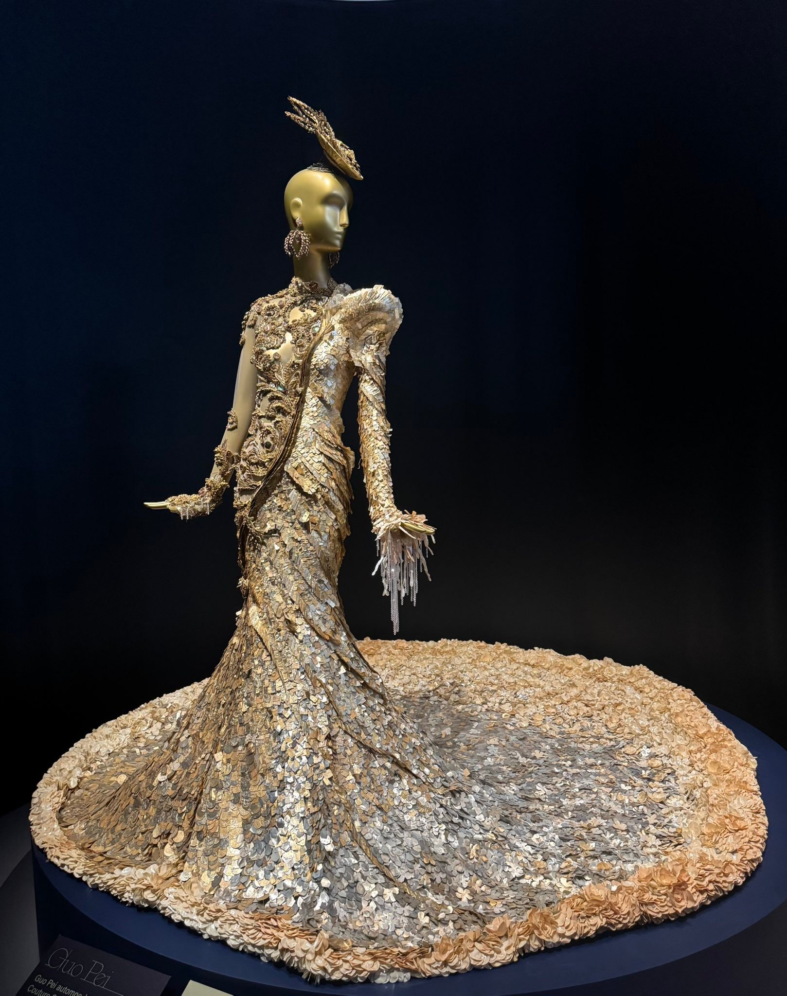 This dress took 675 hours of artisanal hand crafted work ….. 14,000 golden safety pins & adorned with singularly selected French antique beads