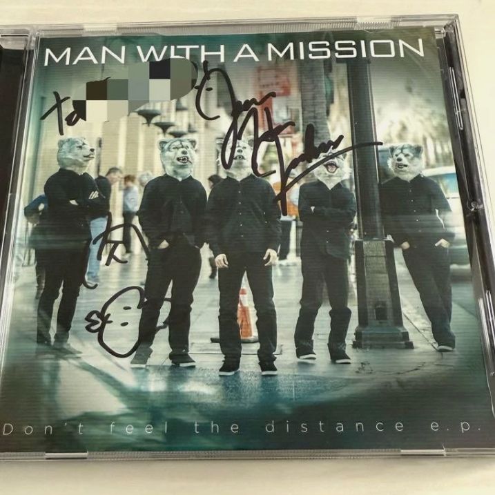 Man with a mission autographed cd
