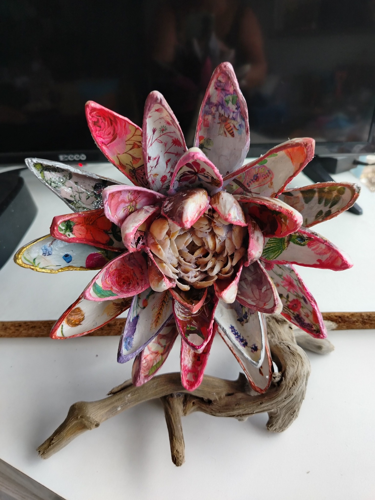 Finishing off an order for a mussel shell flower in shades of pink