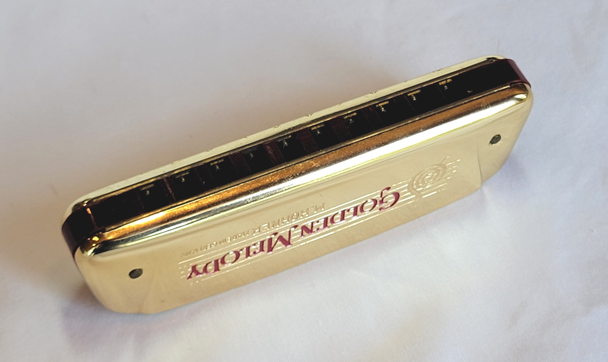 What are the earliest US Hohner Golden Melody harmonicas with gold