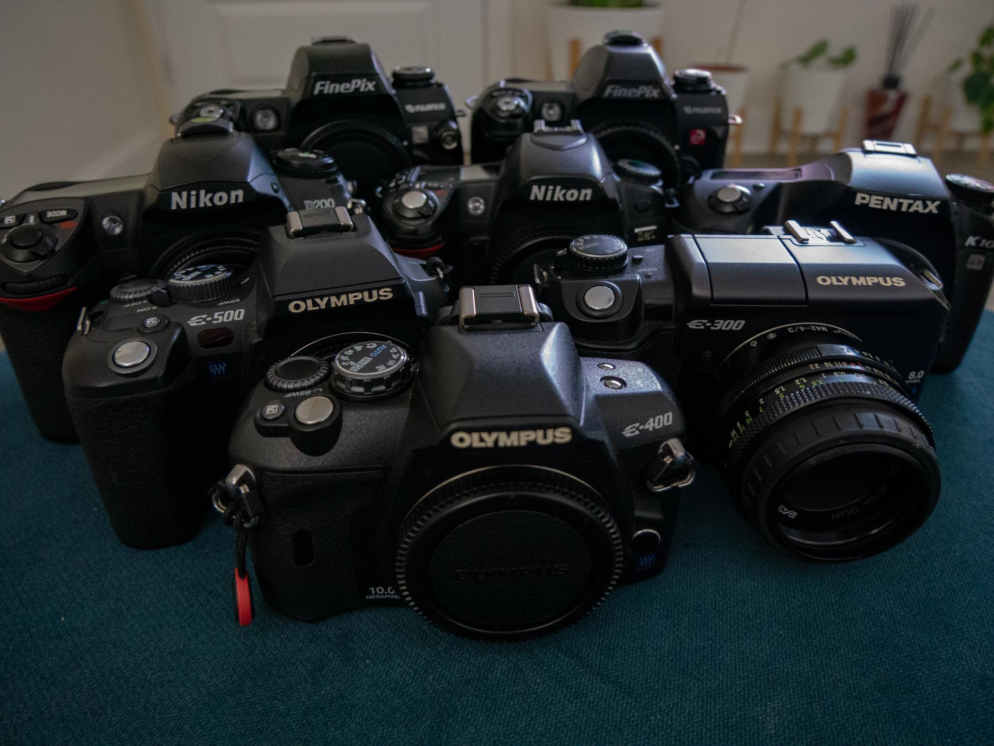 Vintage CCD camera collection with Fujifilm, Nikon, and Olympus