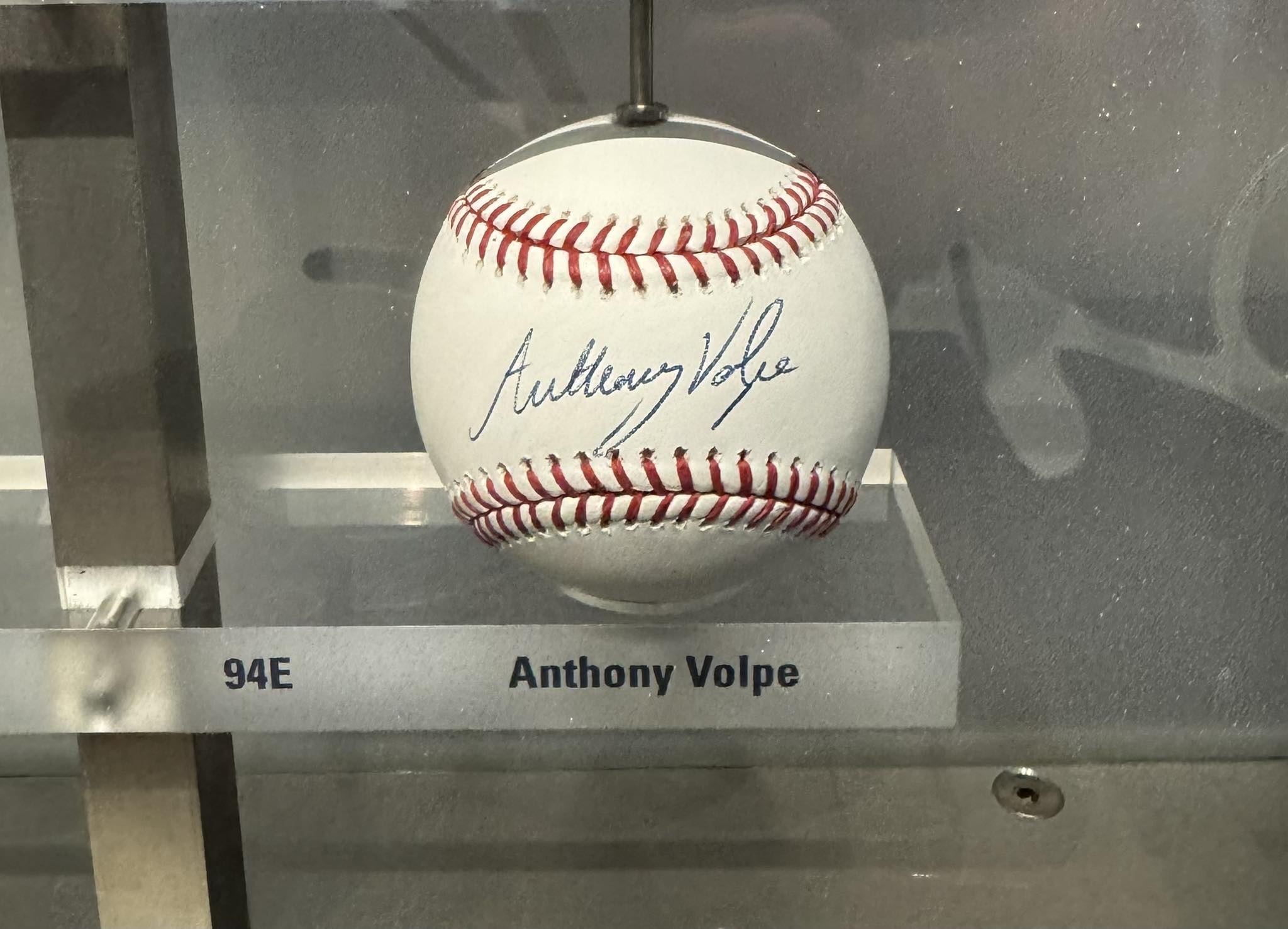 Anthony Volpe adds his signature to the legendary autograph wall