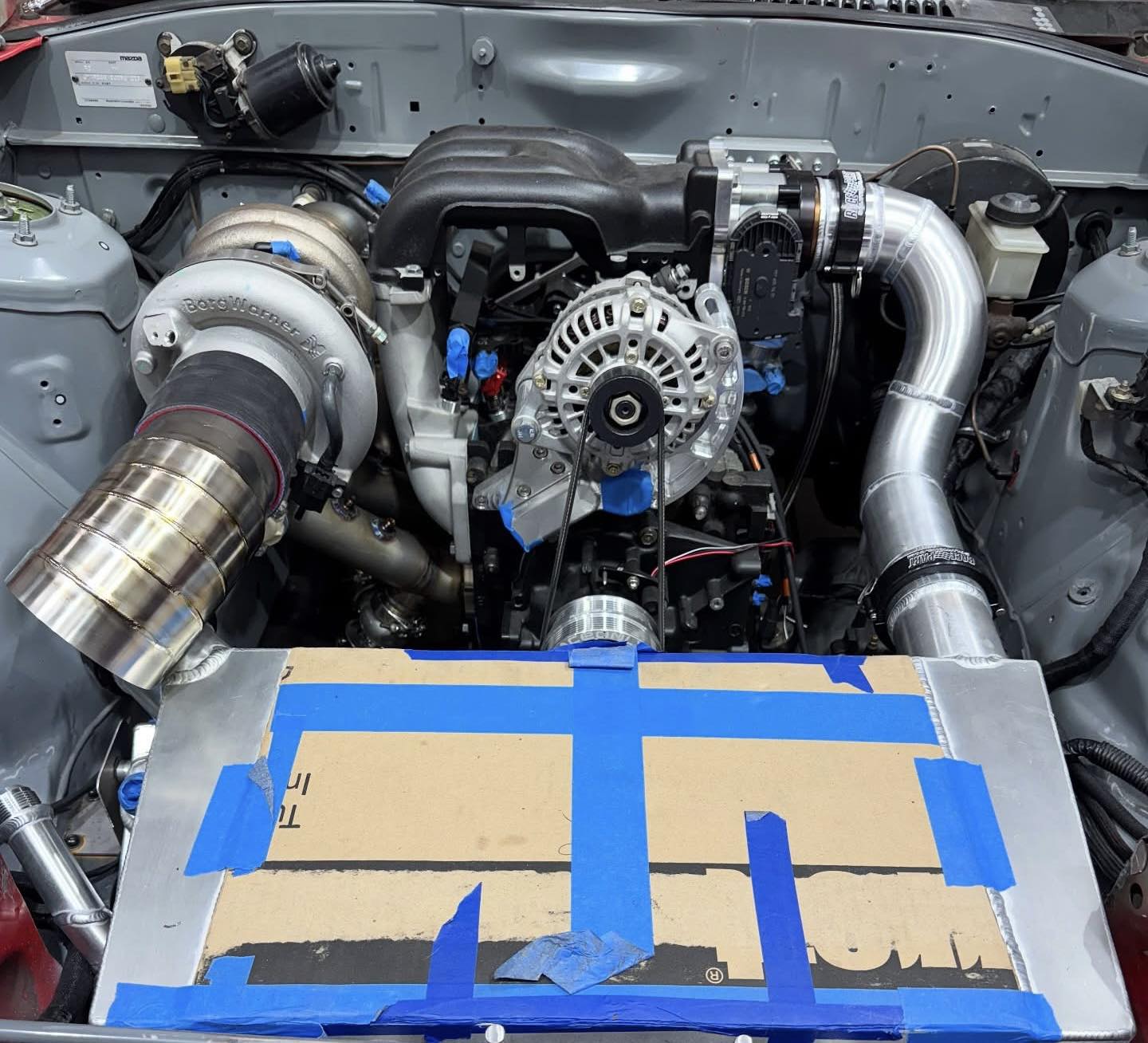 Mazda RX7 | Can anyone chime in on coolant line routing using an EWP ...